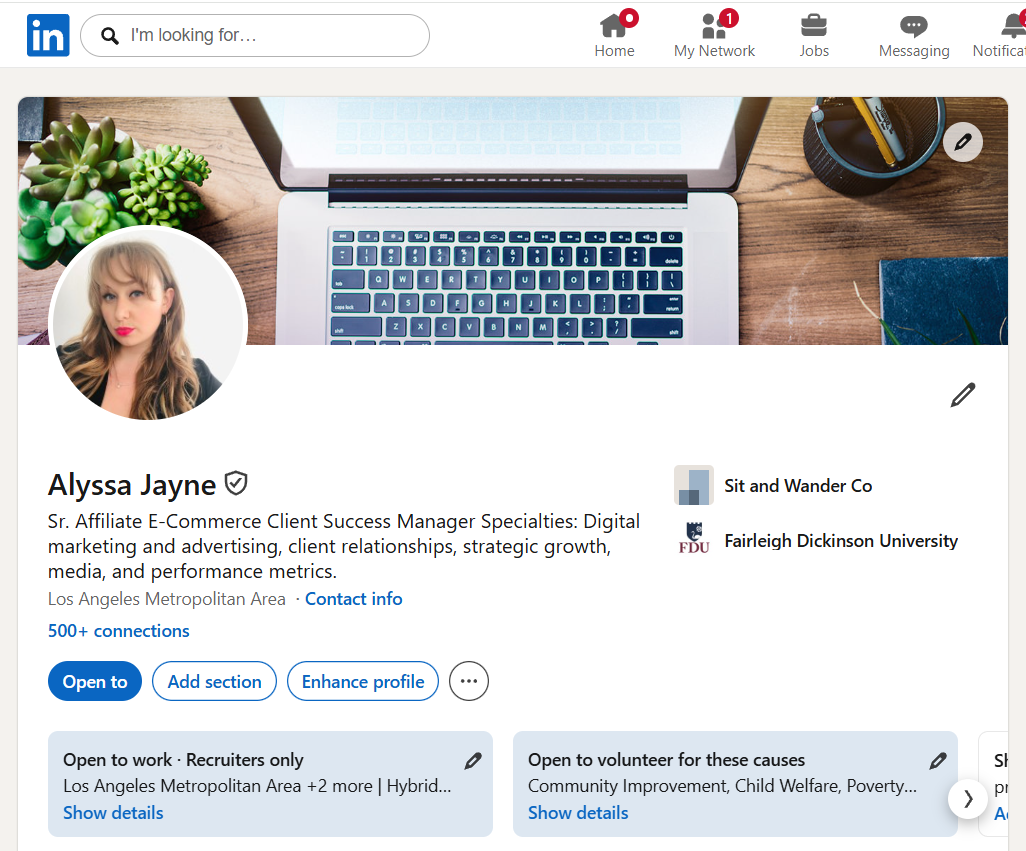 LinkedIn profile page of Alyssa Jayne, featuring a cover photo of a laptop, a notebook, headphones, and plants on a wooden desk. Profile picture of a woman with blonde hair and red lipstick.