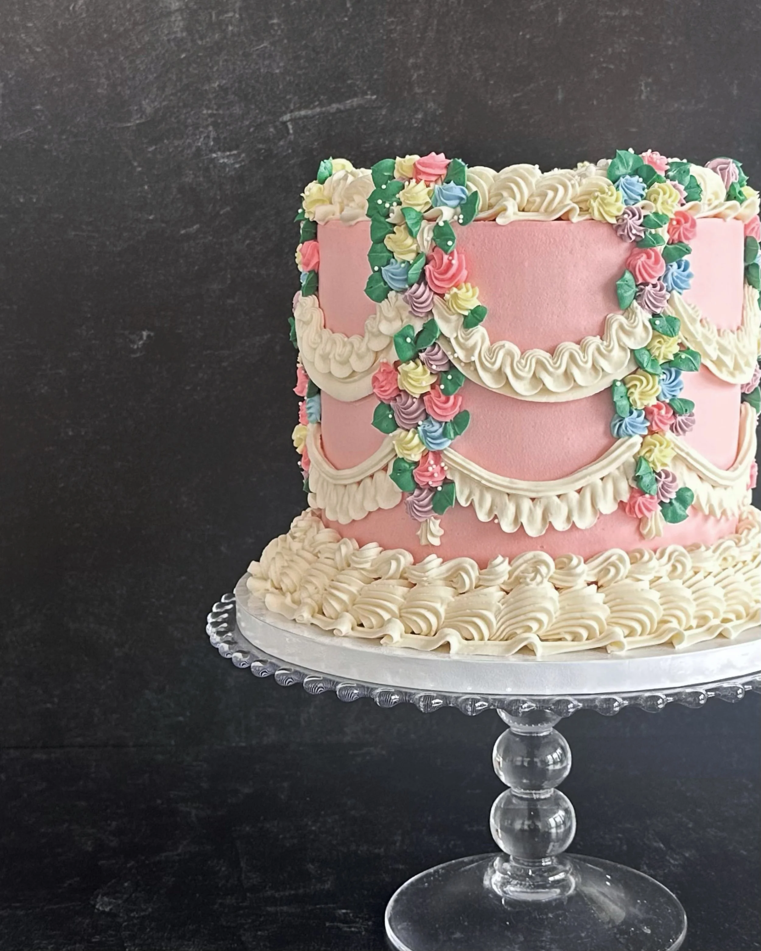 A buttercream cake with vintage piping