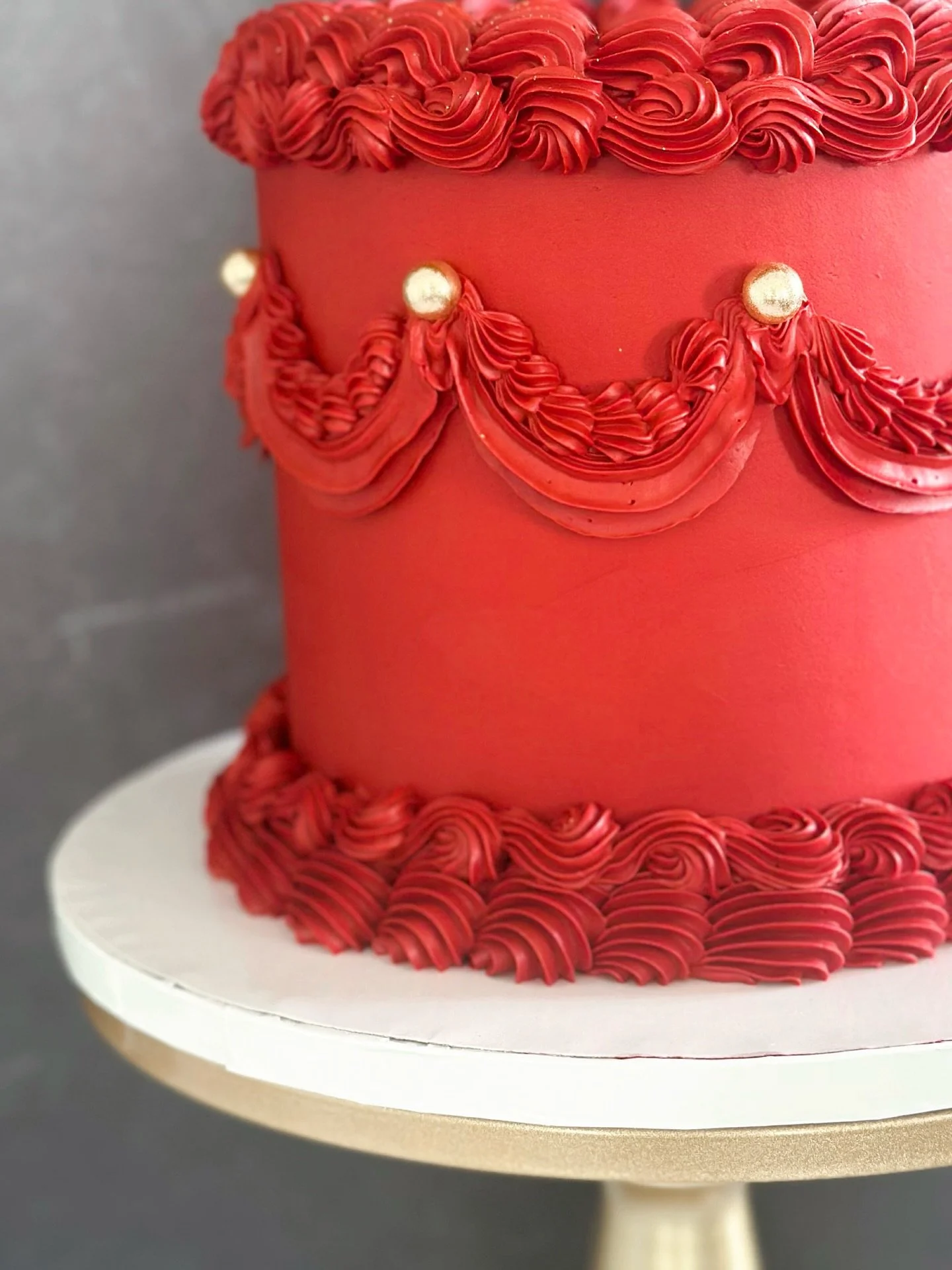 A little opulence never hurt.
Textured piping, gold drag&eacute;es, and a bold red that speaks for itself.
Decadent design for a celebration that deserves to be center stage. ✨ #njcakes #jerseycity #jerseycityeats #hoboken #hobokeneats #cake