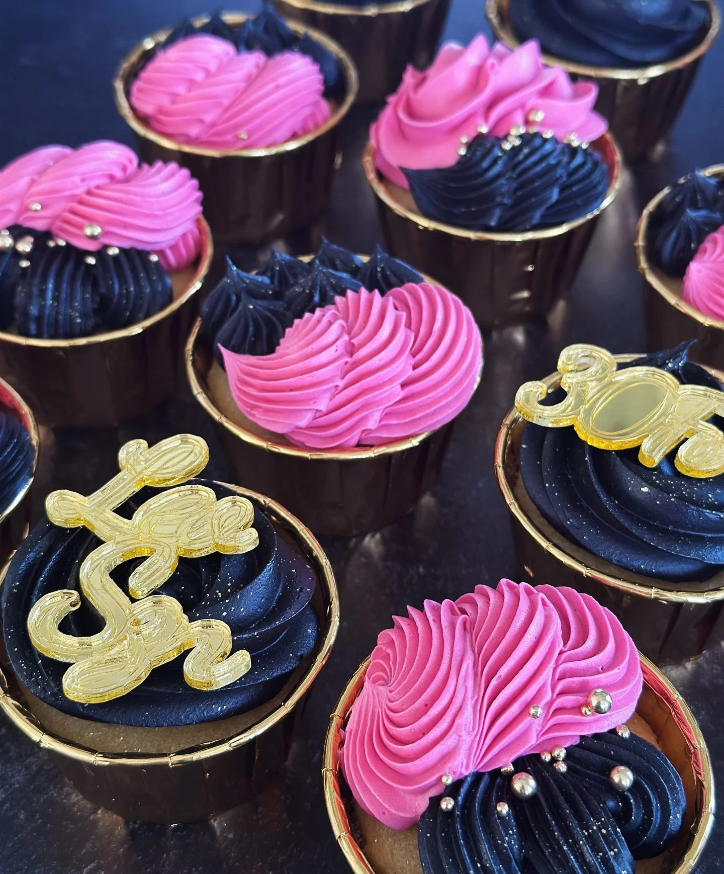 If there was ever any doubt that we&rsquo;re in peak Leo Season&hellip; these bold black-and-gold cupcakes with custom gold acrylics make it clear: Leos like it loud, or not at all. 🦁 ♌️ 🌈 #njcakes #jerseycity #jerseycityeats #hoboken #hobokeneats 