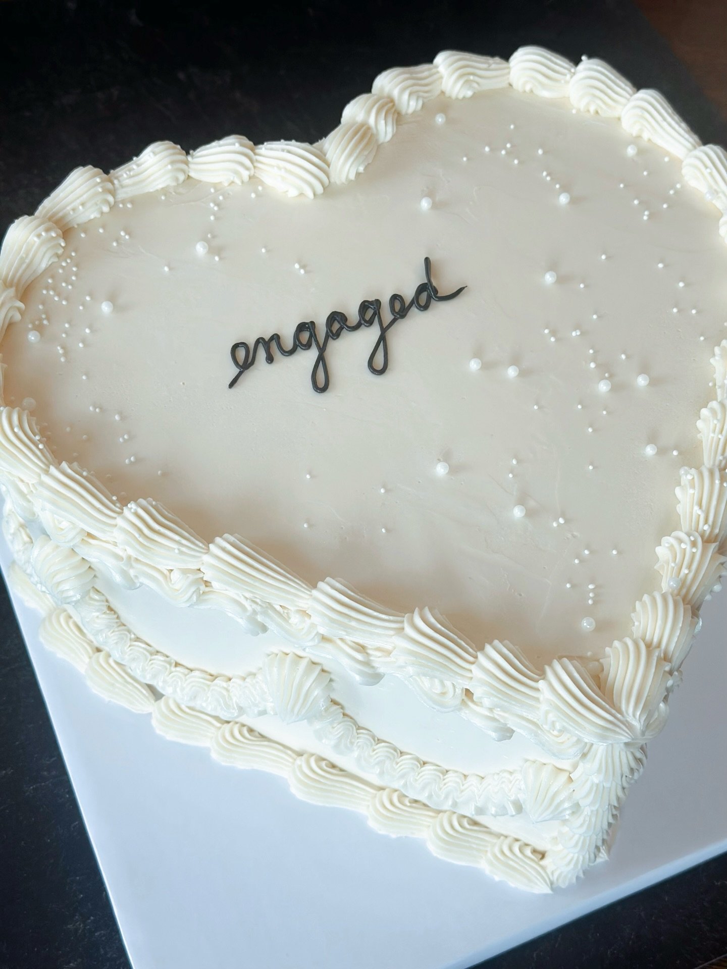 💍 the most perfect engagement cake from this past weekend&mdash;classic white, vintage piping, and white pearl details to complete the look. Cheers to the happy couple 💫 #njcakes #luxuryweddingcakes #jerseycityeats