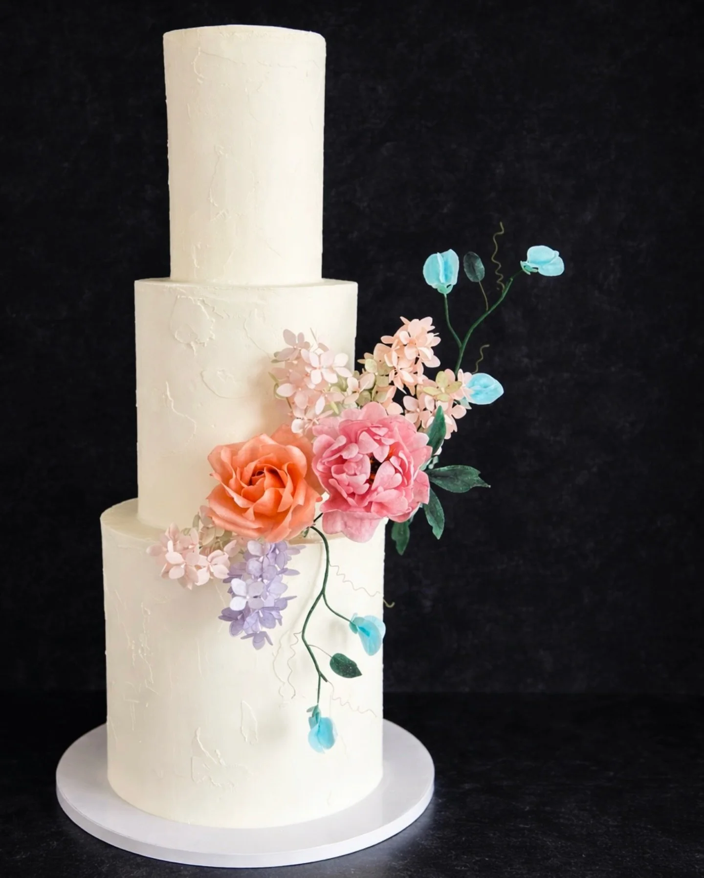 💍 There is something about wafer paper flowers that speaks directly to my soul as a cake designer&mdash;each petal cut, shaped, colored and assembled by hand to form a complete, beautifully imperfect (and edible!) flower. 🌺 

You might be surprised