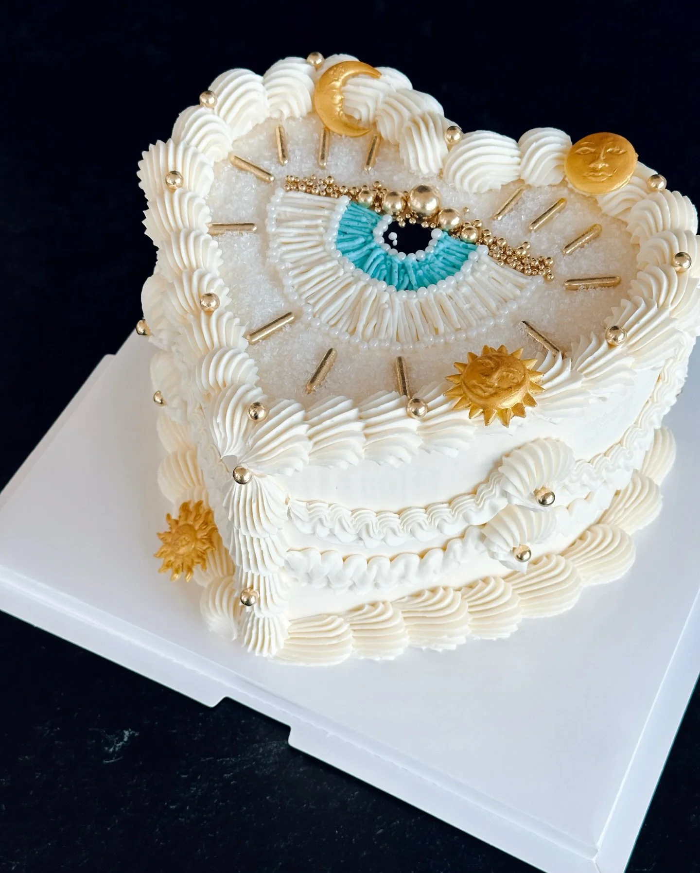 Somehow this is the first evil eye cake I&rsquo;ve done&mdash;and it came out so gorgeous! 🧿 

Inside, one of my most popular flavors&mdash;White Wedding. Layers of white vanilla bean-almond cake, white chocolate ganache, and house-made raspberry ja