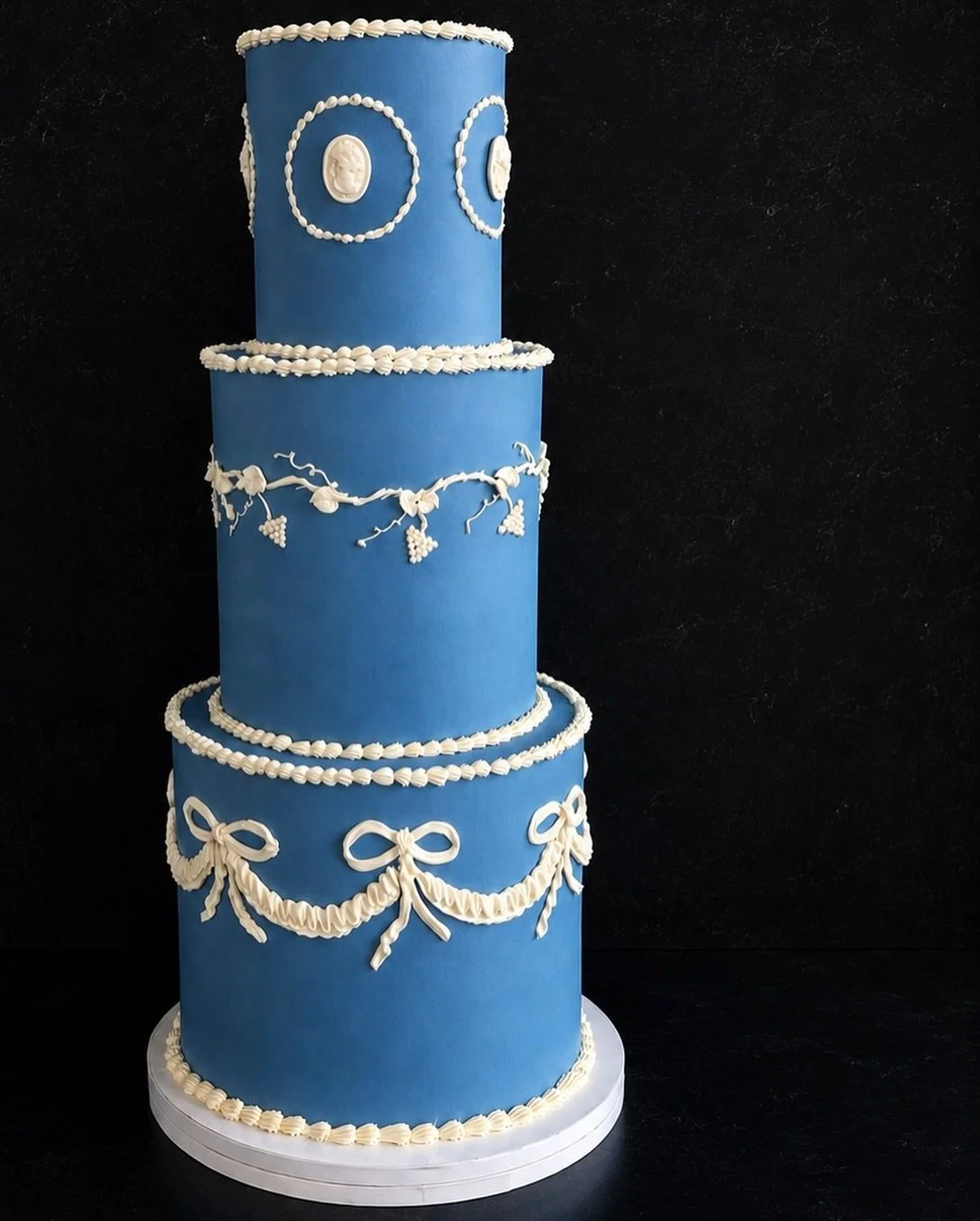 Timeless details, delicate piping, and a silhouette designed to make a statement.

This piece was inspired by antique Wedgwood and old-world wedding elegance.

For A &amp; J, it was important that their cake felt just as intentional and artful as eve