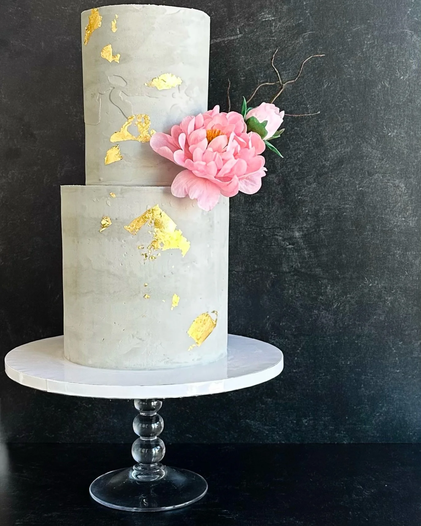 Creative freedom is one of the greatest gifts a client can give an artist.

This cake was commissioned as a birthday surprise for an accomplished architect whose favorite flower is the peony. Drawing inspiration from both, I paired a modern concrete-