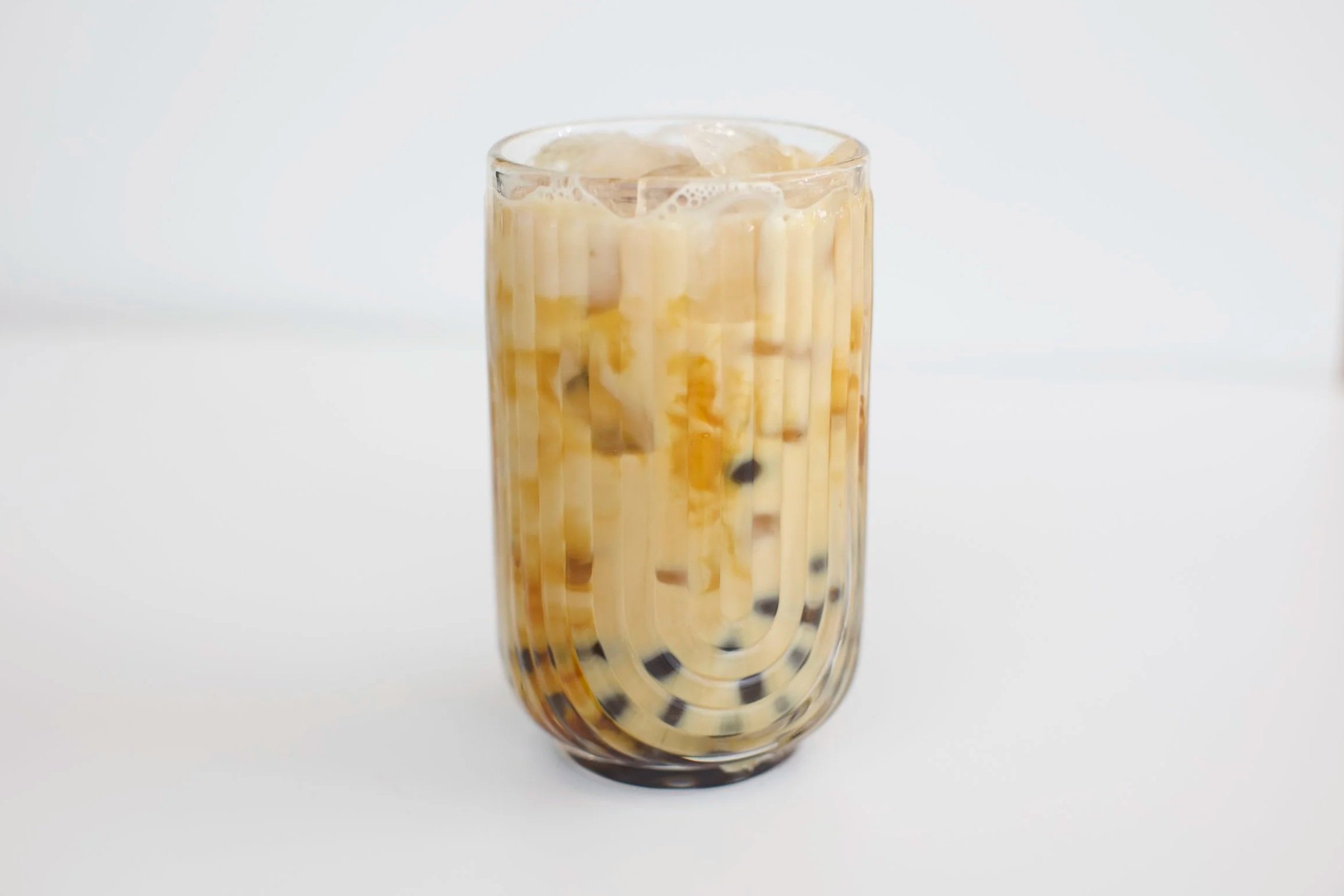 Brown Sugar Milk Tea / House-made brown sugar milk tea with brown sugar popping boba. Served iced, 16 oz.