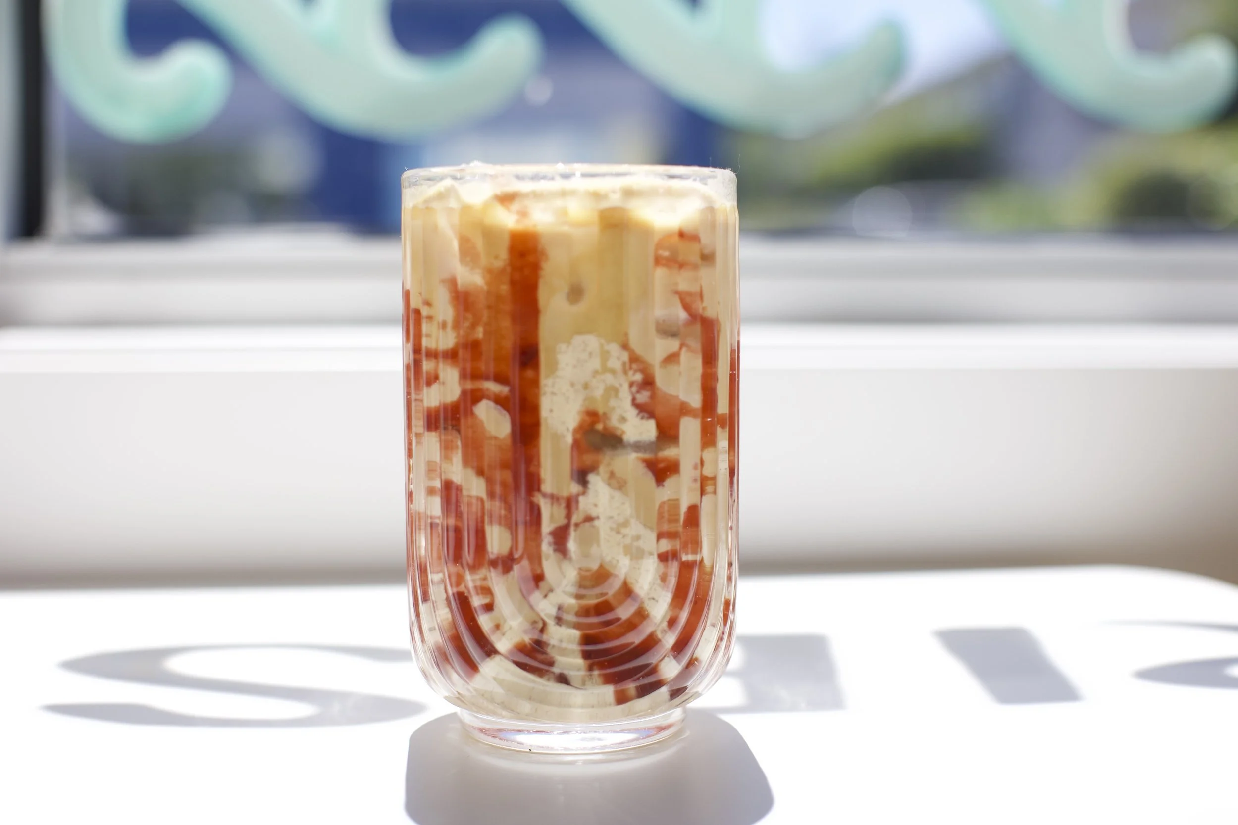Peanut Butter & Jelly Latte / Creamy peanut butter and sweet strawberry flavors blended with espresso and milk for a nostalgic twist on a classic. Served iced.