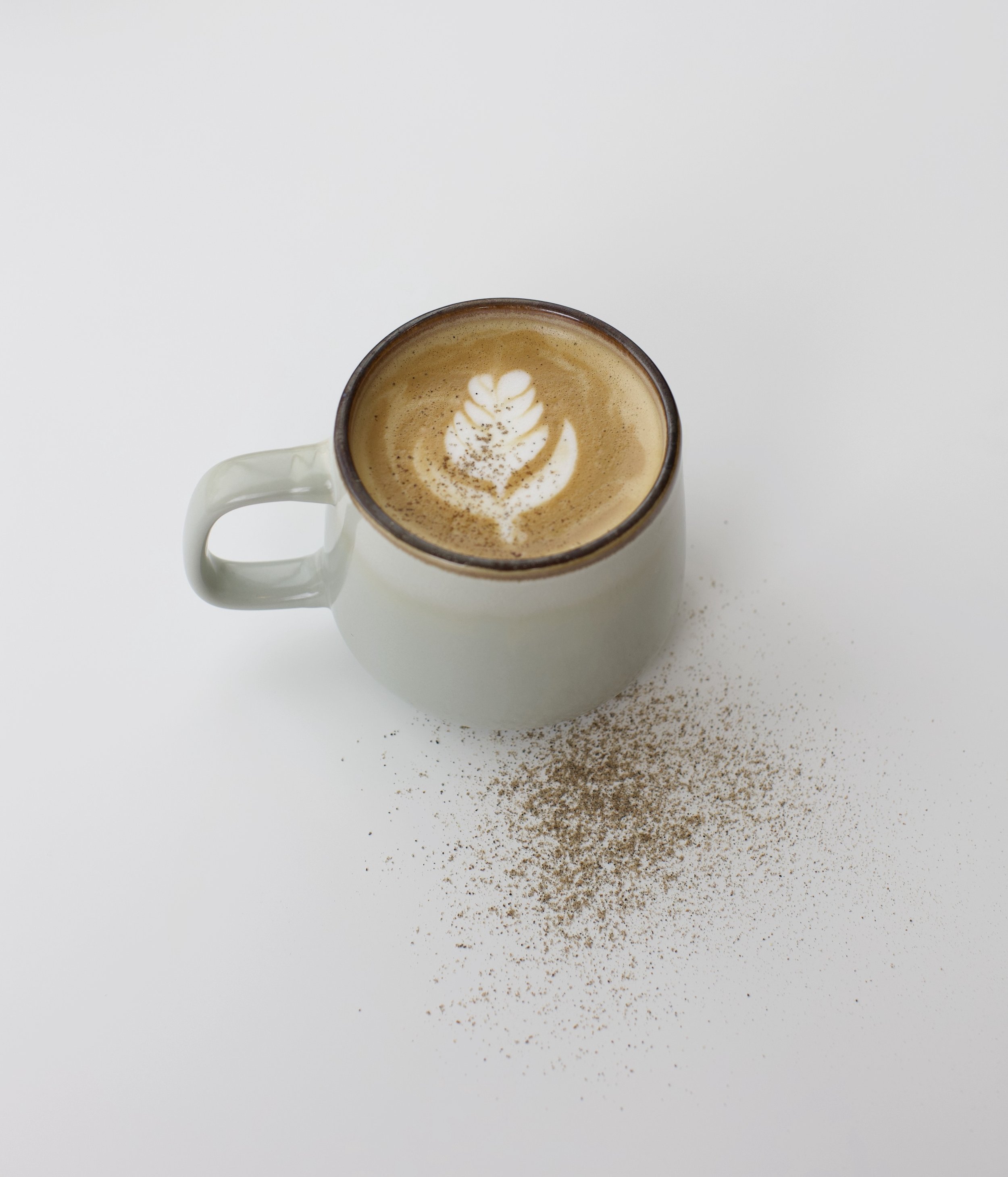 Hygge Latte / (Pronounced “hoo-gah”) Espresso and steamed milk with warm cardamom and almond syrup, finished with a light cardamom dusting. Cozy, nutty, and gently spiced.