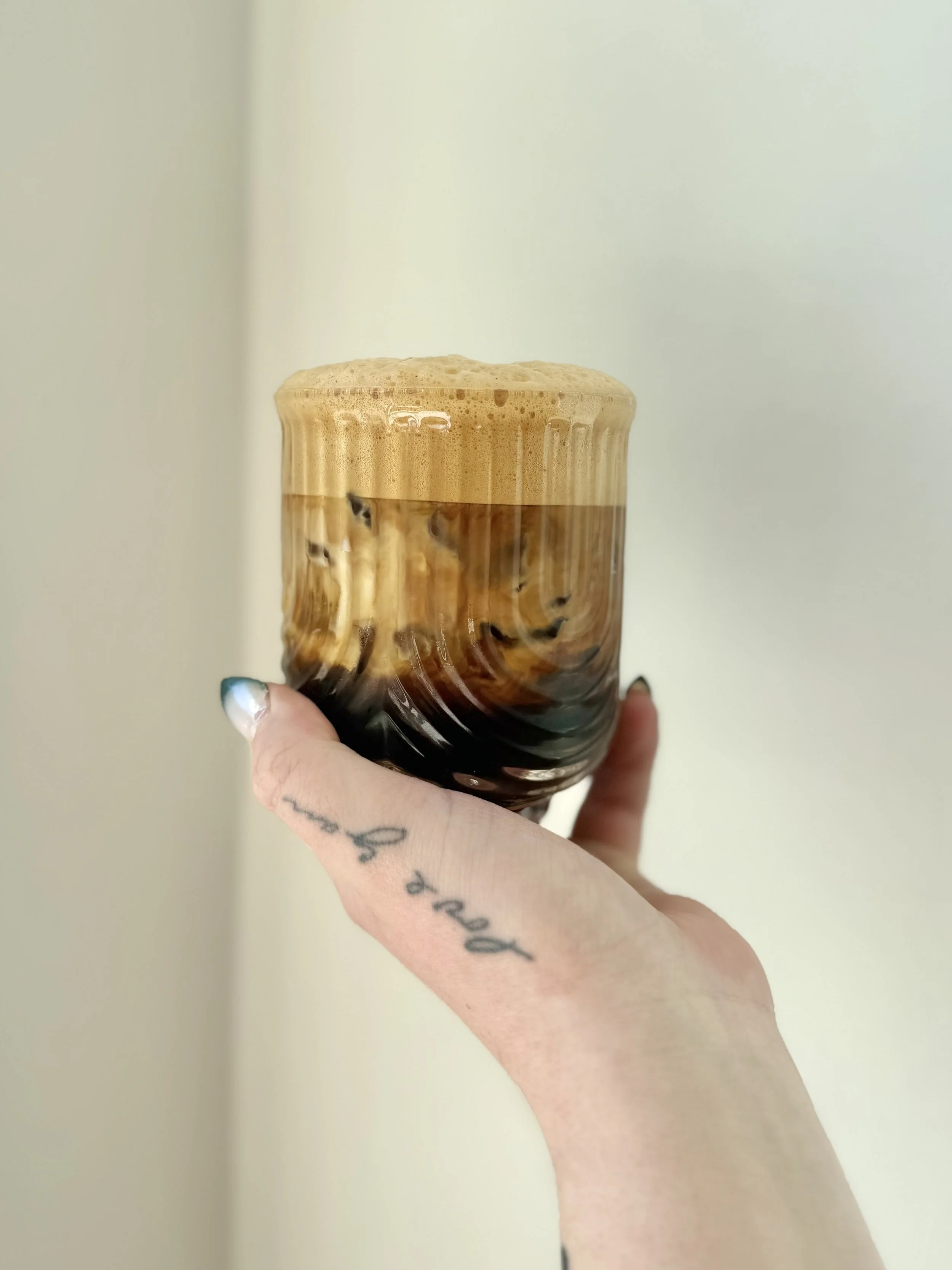 Shaken Espresso / Doppio over ice - shaken, topped with milk or cream. Served iced.