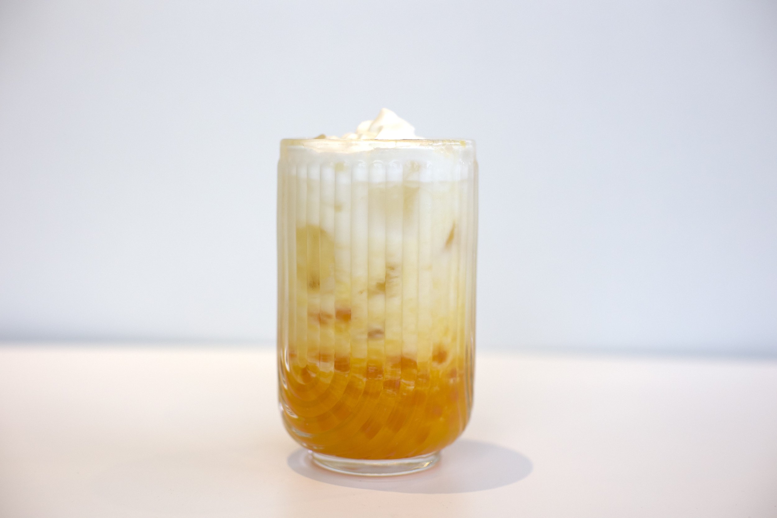Mango Cloud / Mango coconut milk with coconut cream cold foam and mango 
popping boba. Served iced, 16 oz.
