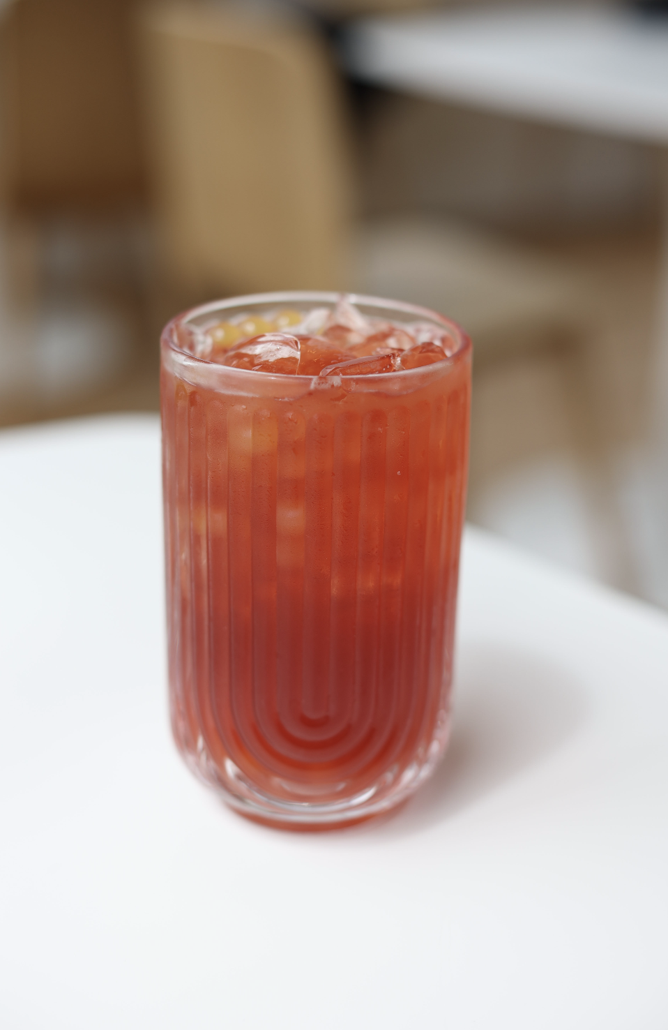 POM Spritz / Passionfruit hibiscus tea with orange syrup and mango popping boba. Served iced, 16oz.