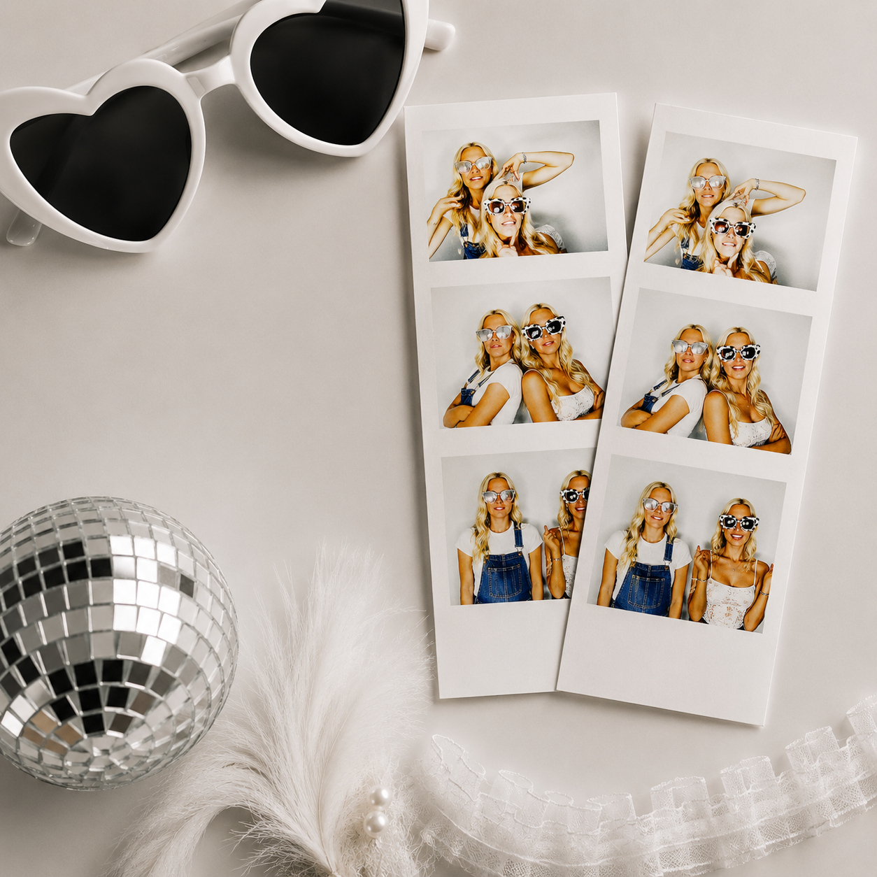 Two photo strips of two women with blonde hair and sunglasses, posing together, with heart-shaped sunglasses, a disco ball, a feathered accessory, and floral lace fabric in the background.