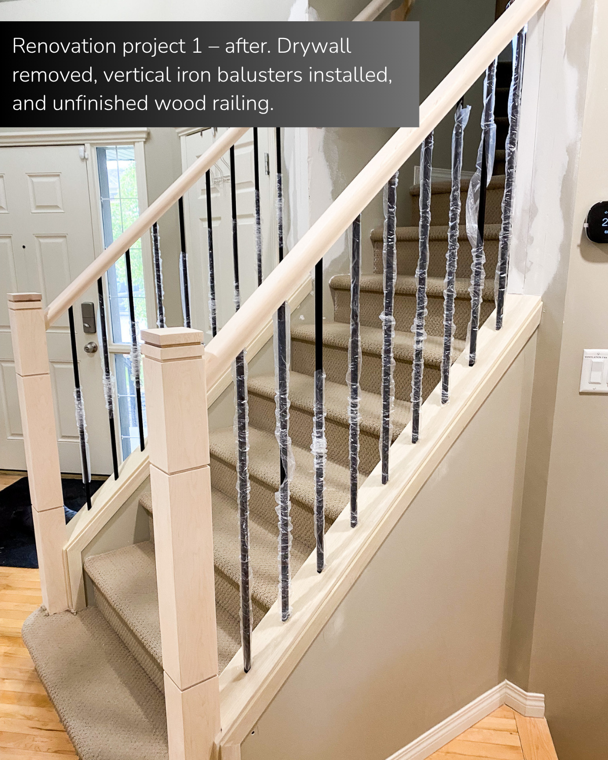Renovation project 1 - after. Drywall removed, vertical iron balusters installed, and unfinished wood railing. 