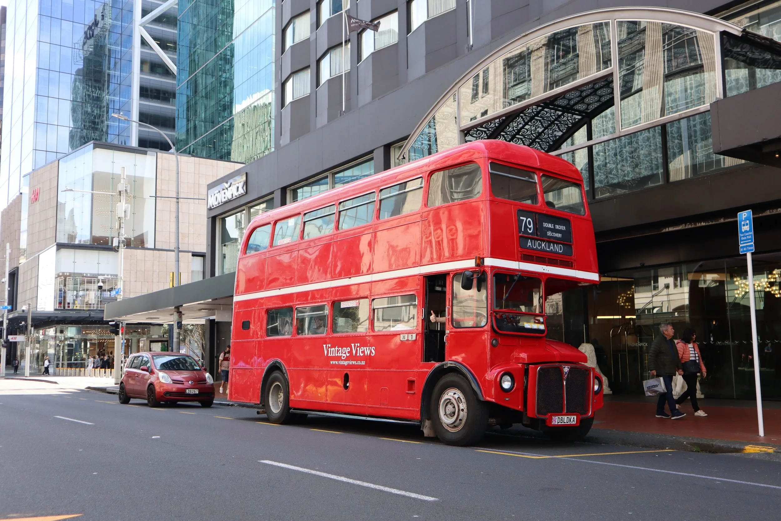 Cruise passengers enjoying an Auckland city highlights tour aboard a vintage Routemaster double-decker. The perfect short excursion within walking distance of the port.