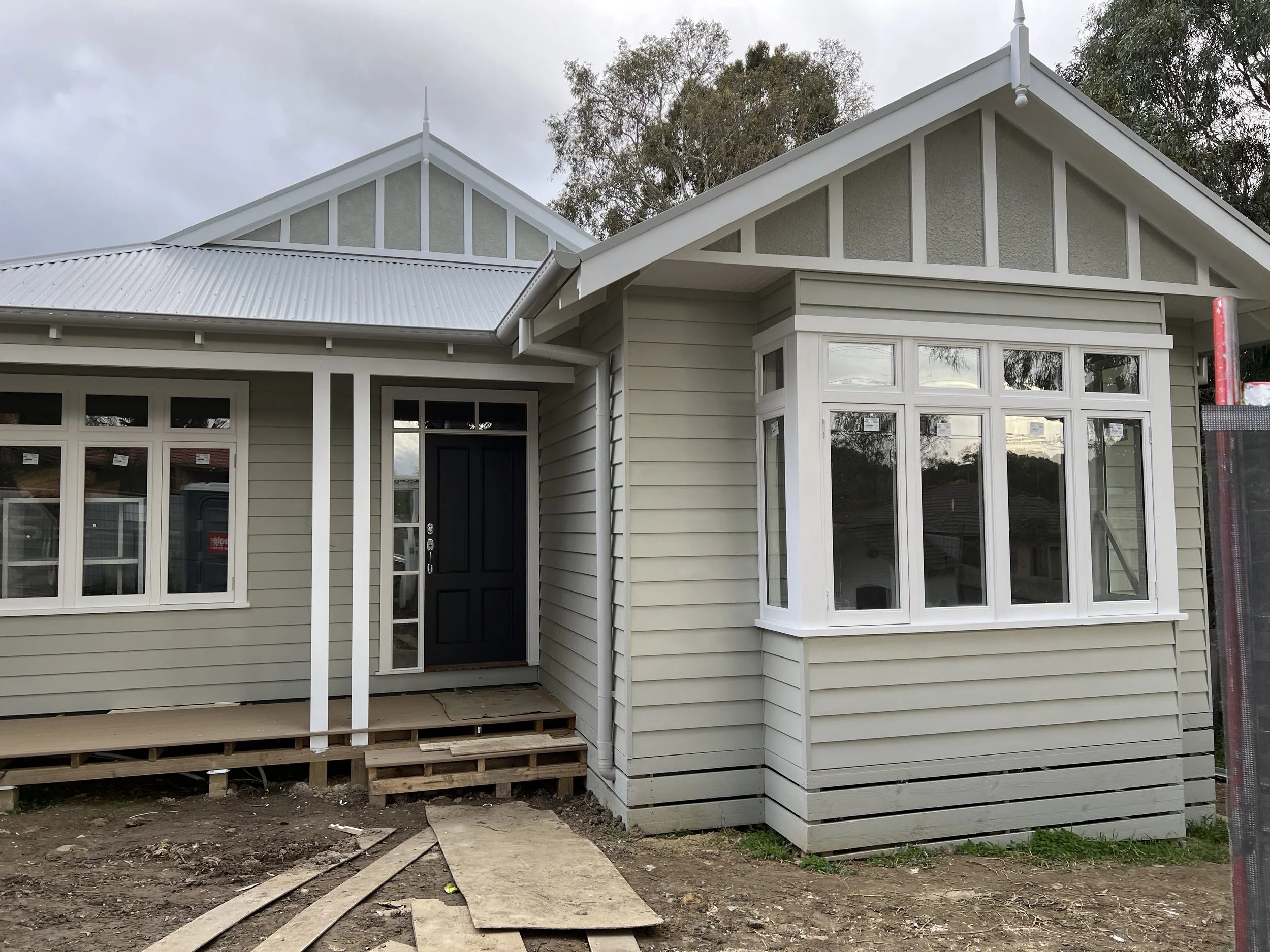 Exterior weatherboard residential painting job in Coburg