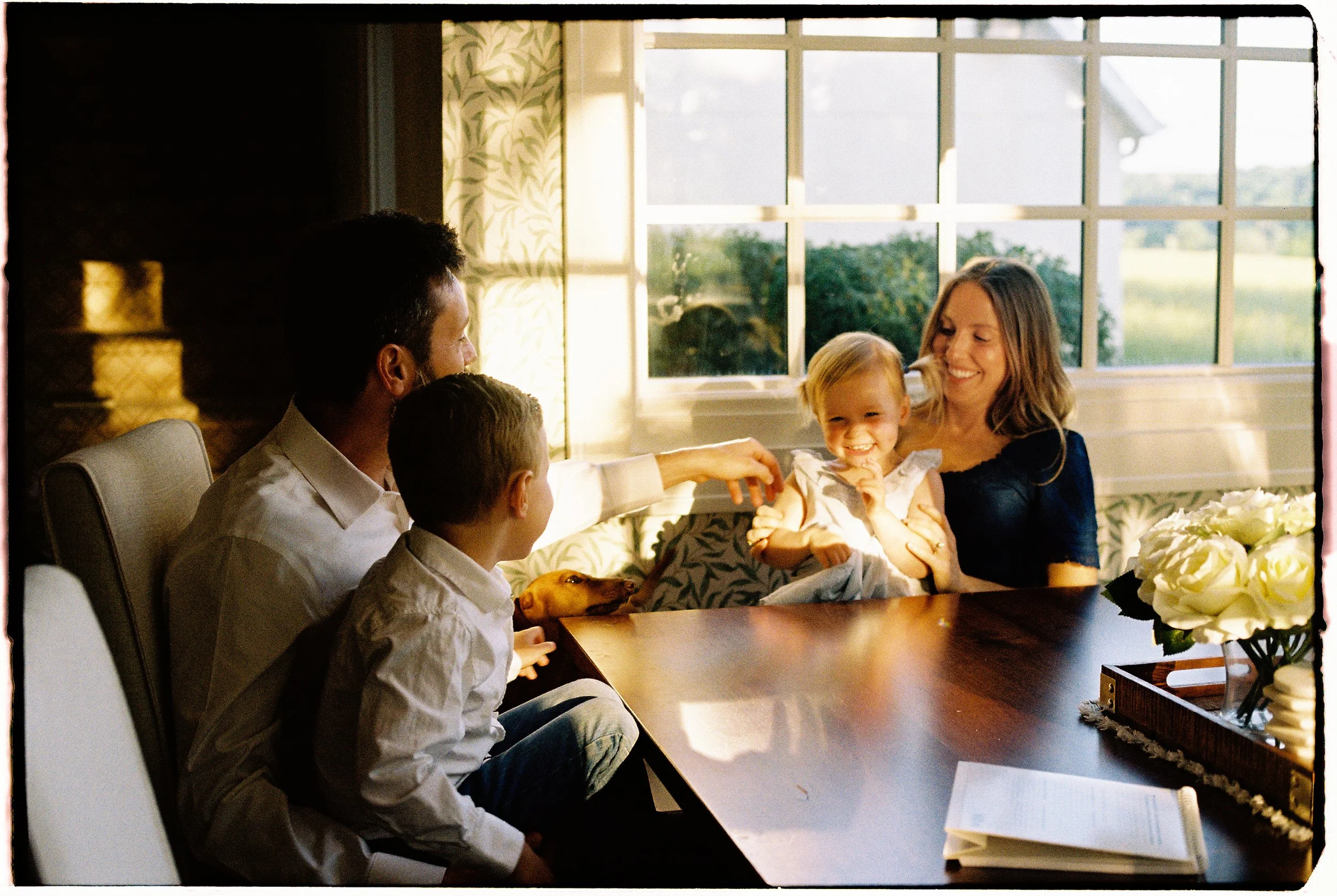 documentary family photographed at home during a candid 35mm film session near Springfield, Missouri.