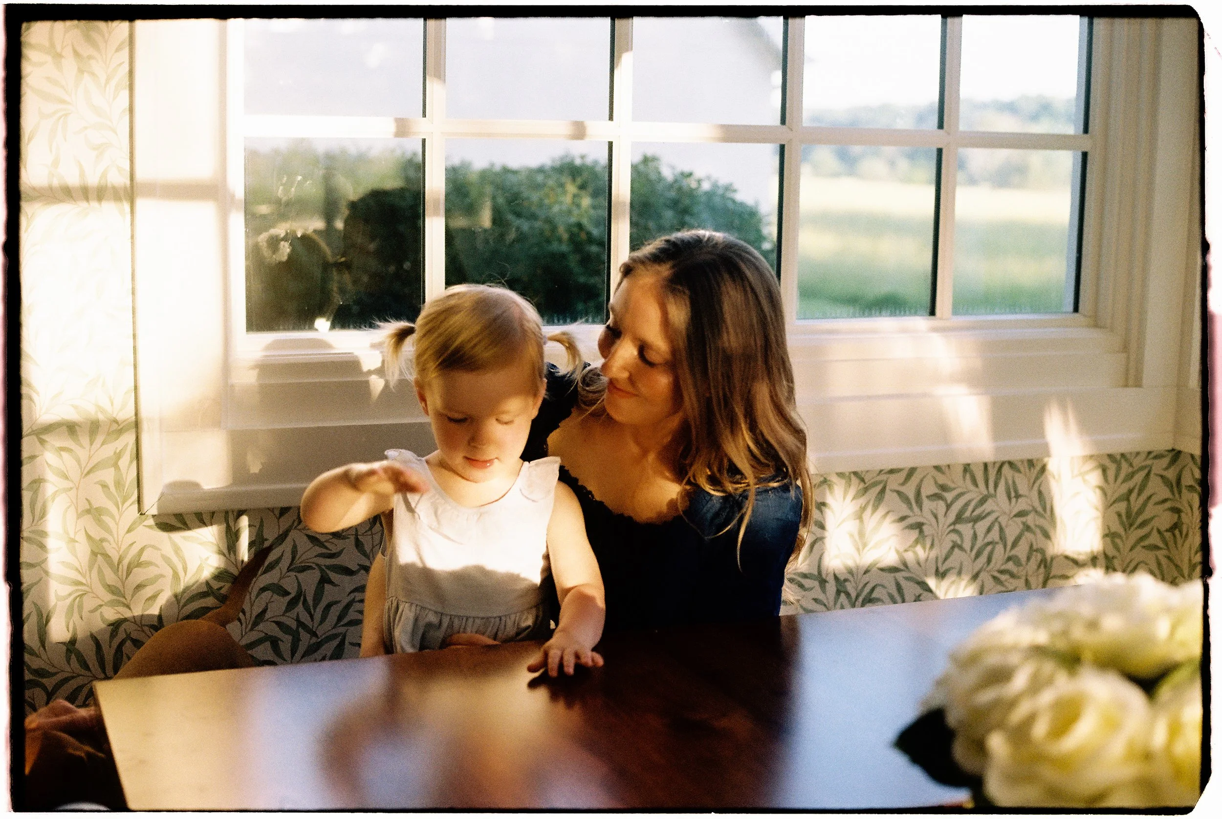 mother photographed at home during a candid 35mm film session near Springfield, Missouri.