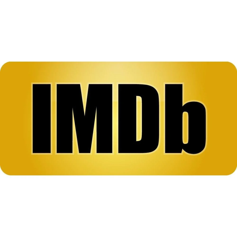 The image shows a yellow camera badge with the word 'IMDb' in bold black letters.