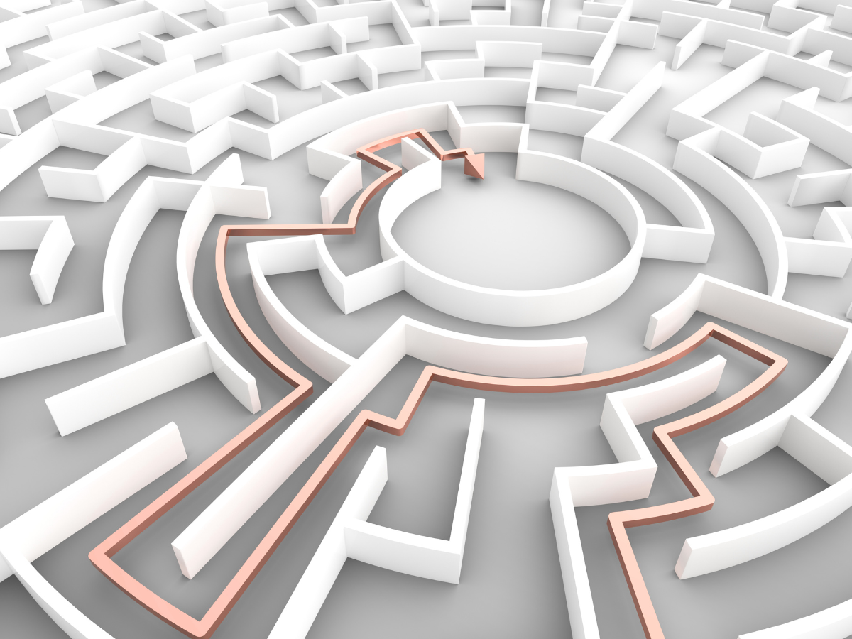 White maze with a path to the center symbolizing SonderWorks’ collaborative approach to co-creating tailored HR strategies.