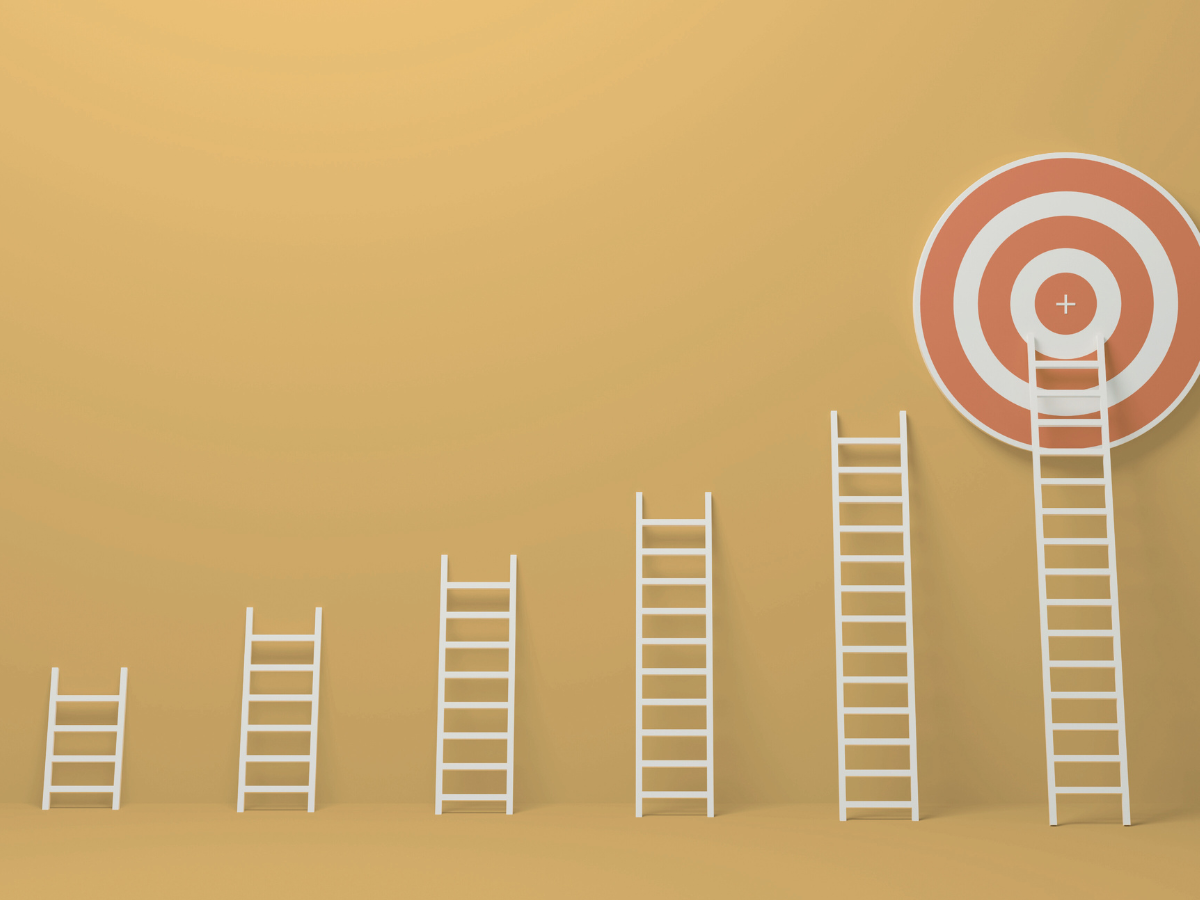 Multiple ladders leading to a target on a golden background, representing SonderWorks’ ability to scale HR systems and adapt alongside client business growth.