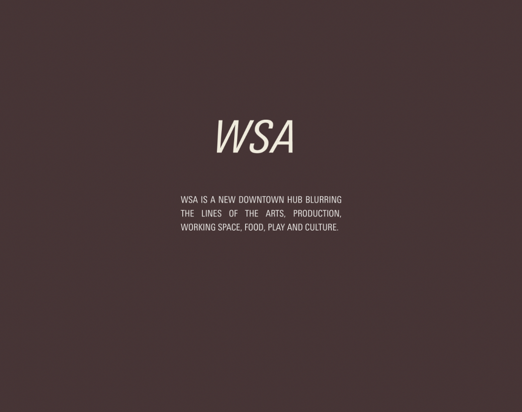 Text on a dark blurred background reads 'WSA' and describes it as a downtown hub for arts, production, workspace, food, play, and culture.