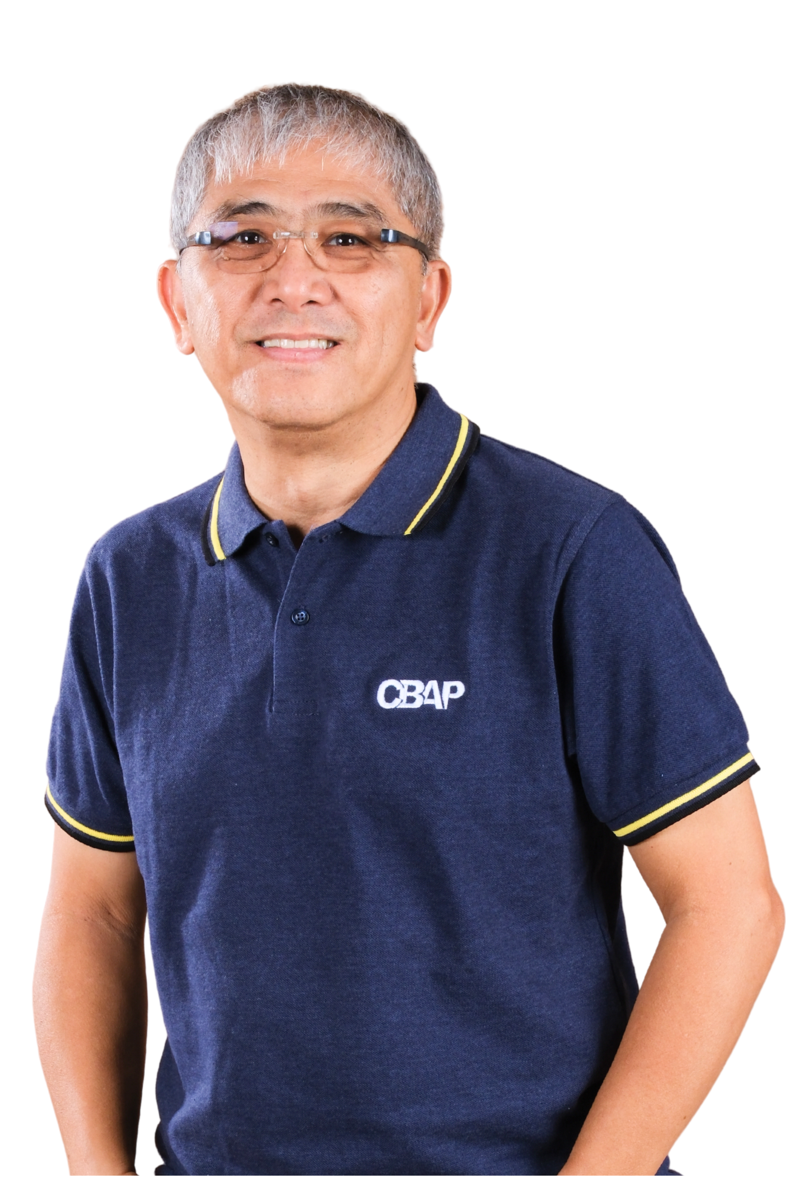 A man with short gray hair wearing glasses and a navy blue polo shirt with yellow trim and the letters 'CBAP' embroidered on it. The background is plain white.