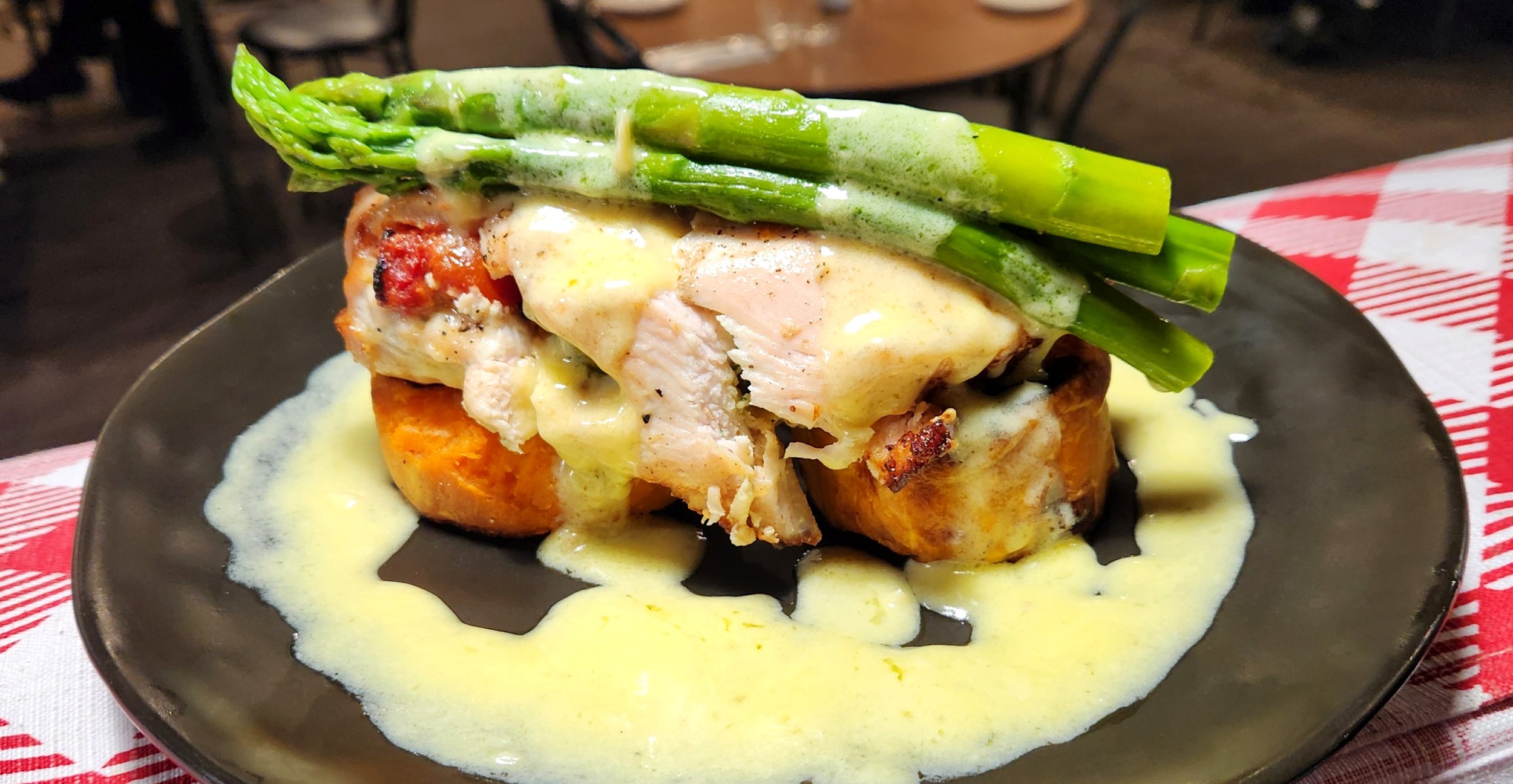

Involtini di Pollo - chicken breast filled with Camembert, semi dried tomato and baby spinach then topped with asparagus spears and a creamy white wine sauce.