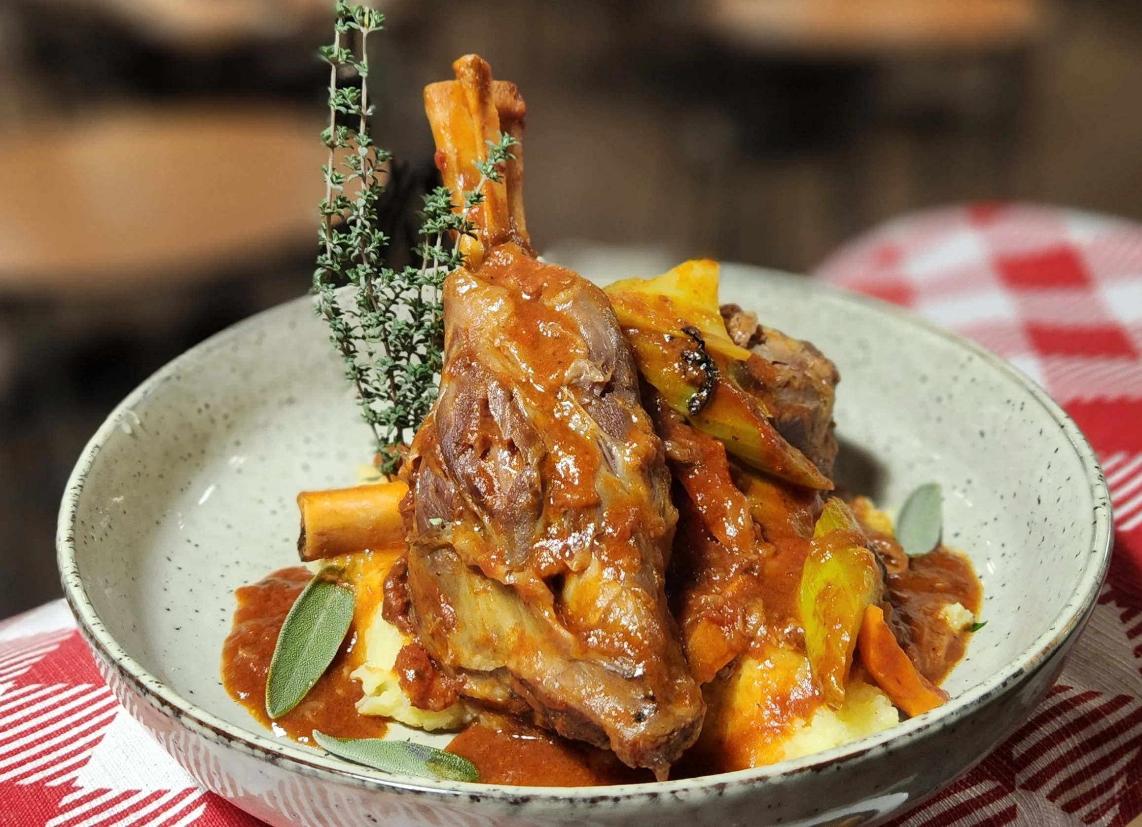 

Agnello - Lamb shanks braised in red wine, tomato and vegetable sauce served on creamy mashed potato
