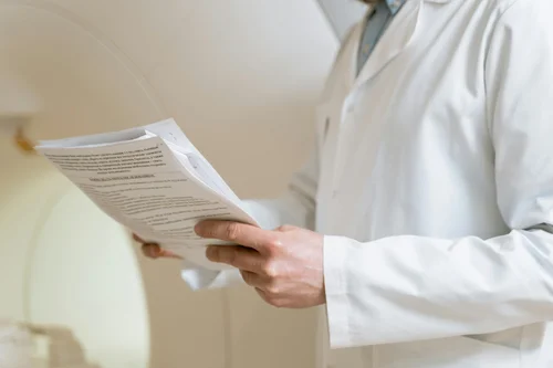 Professional reviewing medical documentation