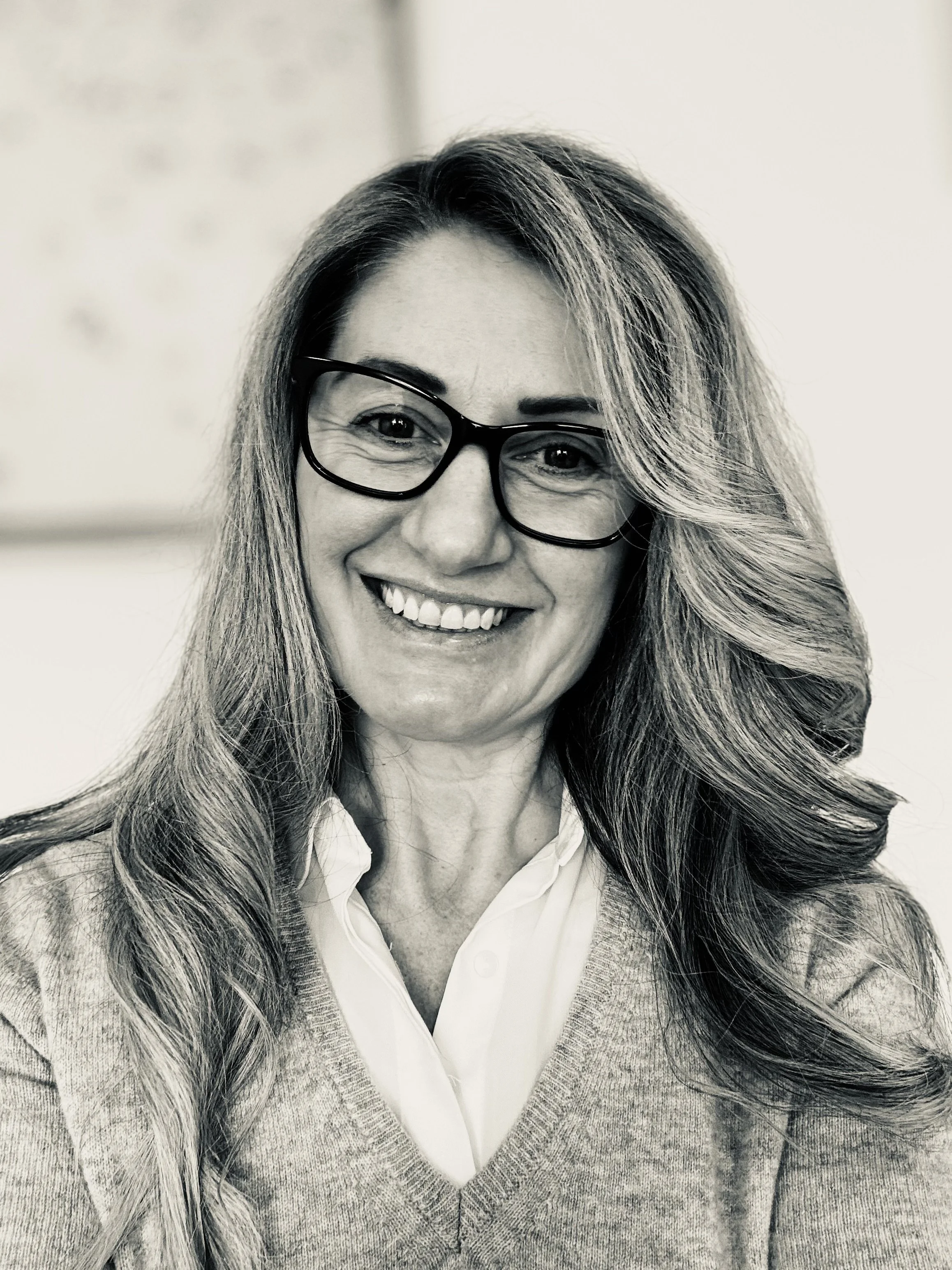 Sami- black and white photo smiling grey jumper over white short