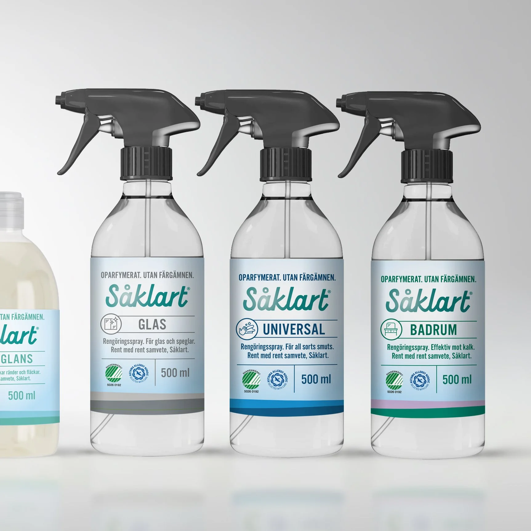 Three spray bottles of cleaning products labeled in Swedish, with spray nozzles, lined up on a flat surface against a neutral background.