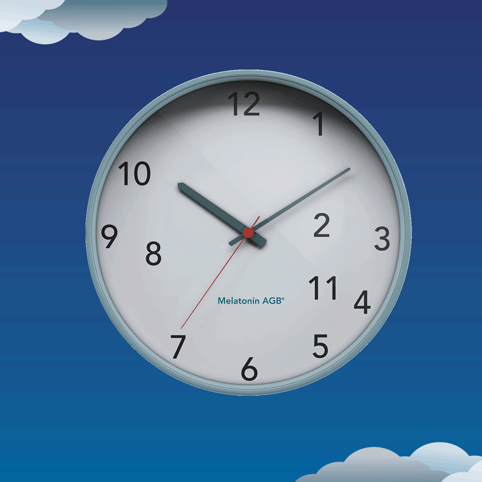 A clock showing the time as 10:11, with a dark blue sky and clouds in the background.