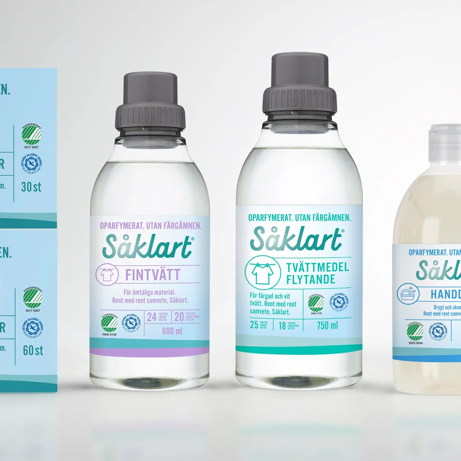 Three bottles of Säkert cleaning products, including a fabric wash and a spray for colored and white clothes, displayed against a white background.