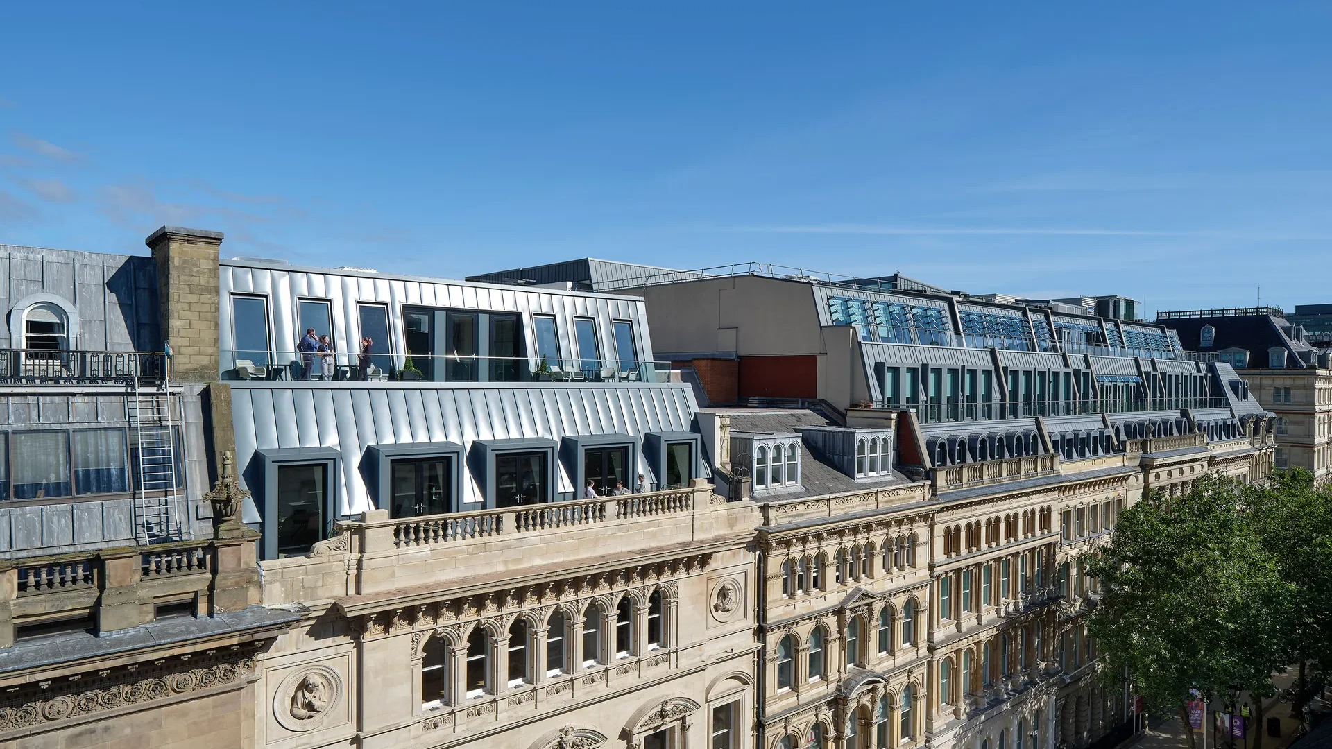 Commercial rooftop air source heat pumps and solar PV installation, representing decarbonisation engineering and electrification of assets.png