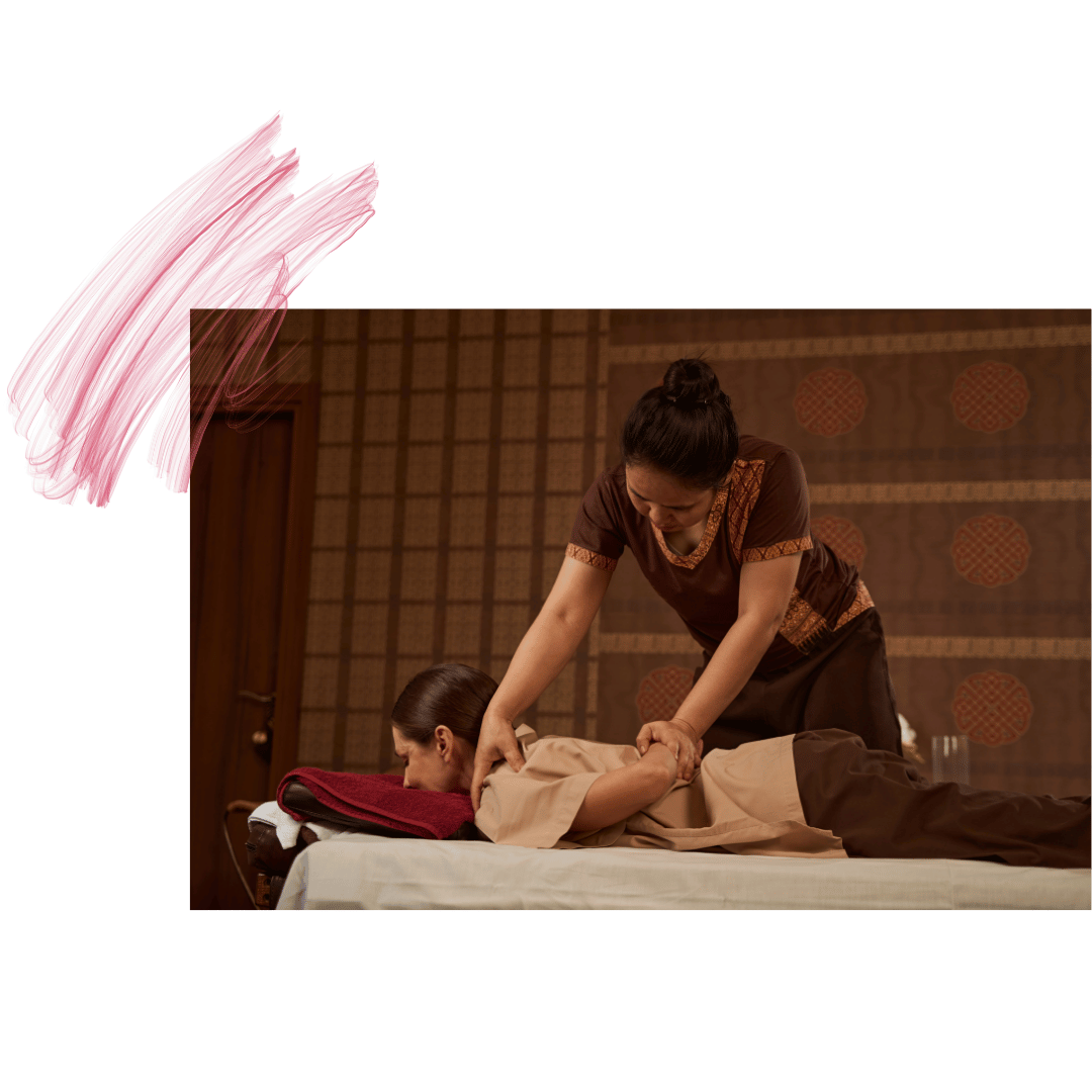 Therapist giving a client a table Thai massage in a traditional setting