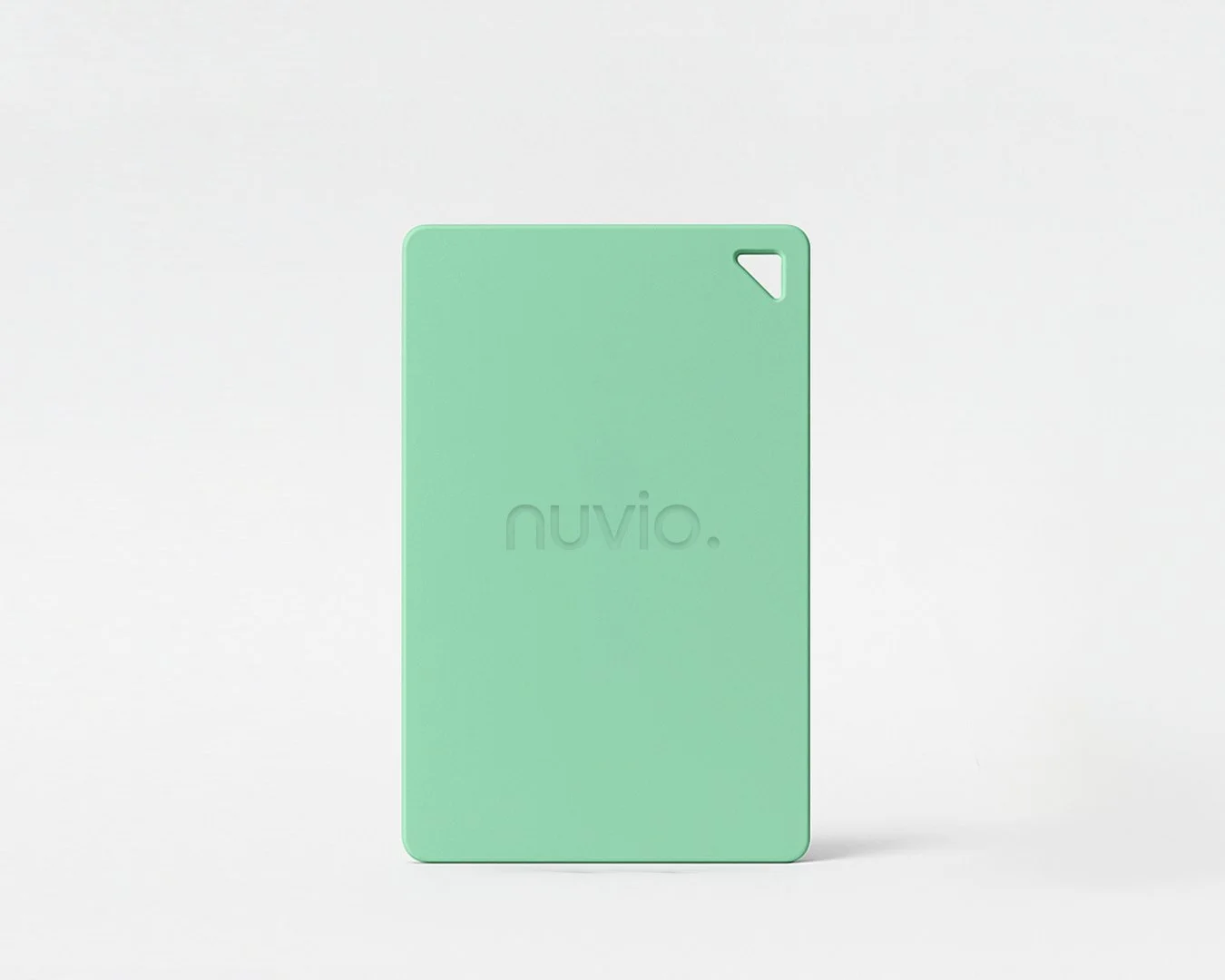 A mint green rectangular plastic device with rounded edges, embossed with the word "nuvio" and a small cut-out in the upper right corner on a white surface.