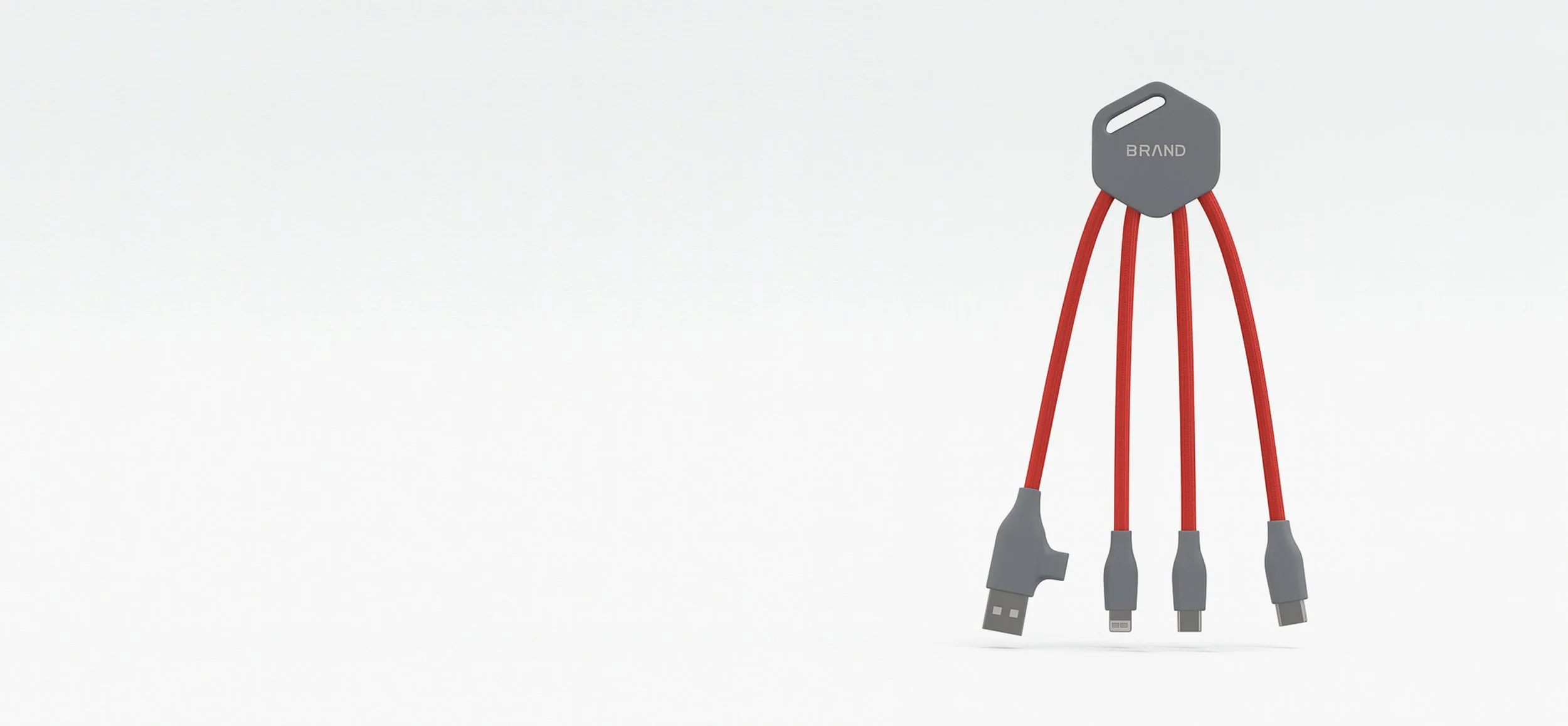 A gray key-shaped USB charger with four red charging cables attached, resembling hair, with each cable ending in different USB connectors.