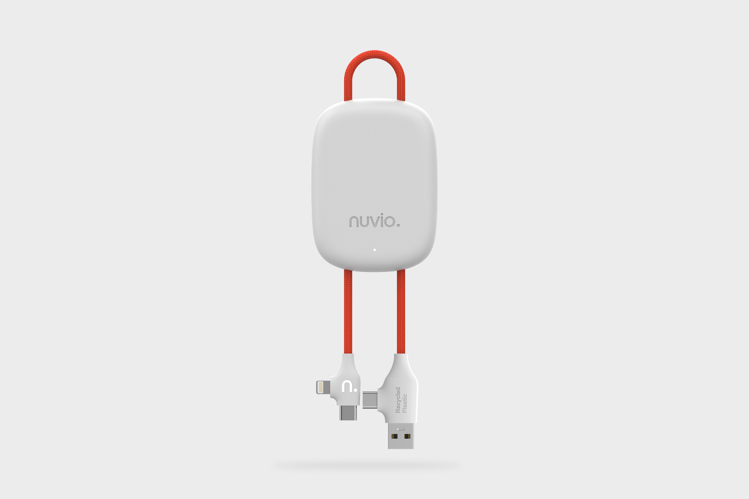 A white electronic device with the brand name 'nuvio' on it, attached to a red braided charging cable that has a Lightning connector on one end and a USB-A connector on the other. The device has a small indicator light at the bottom.