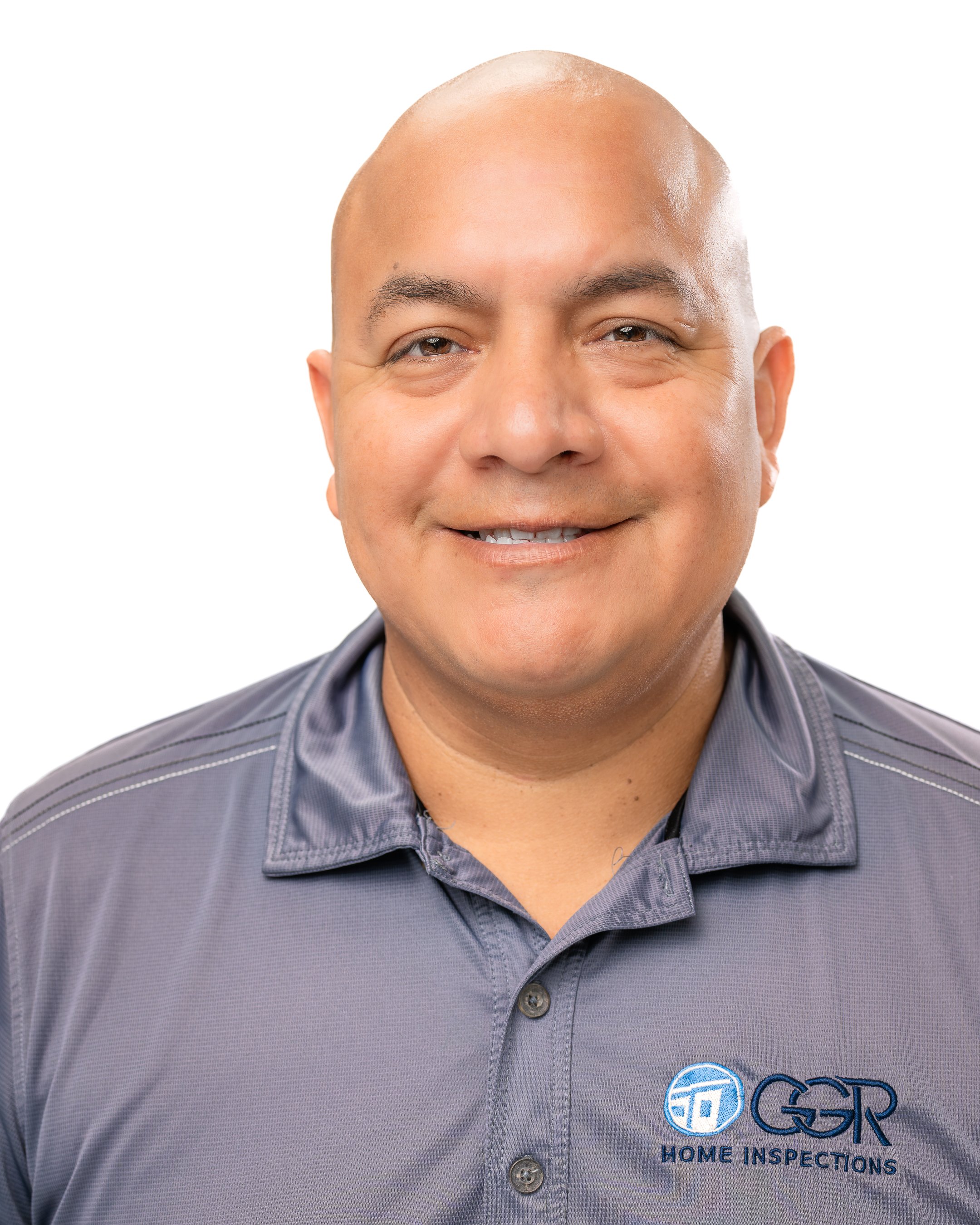 Headshot of a smiling man wearing a gray polo shirt with 'GSR Home Inspections' logo on it.