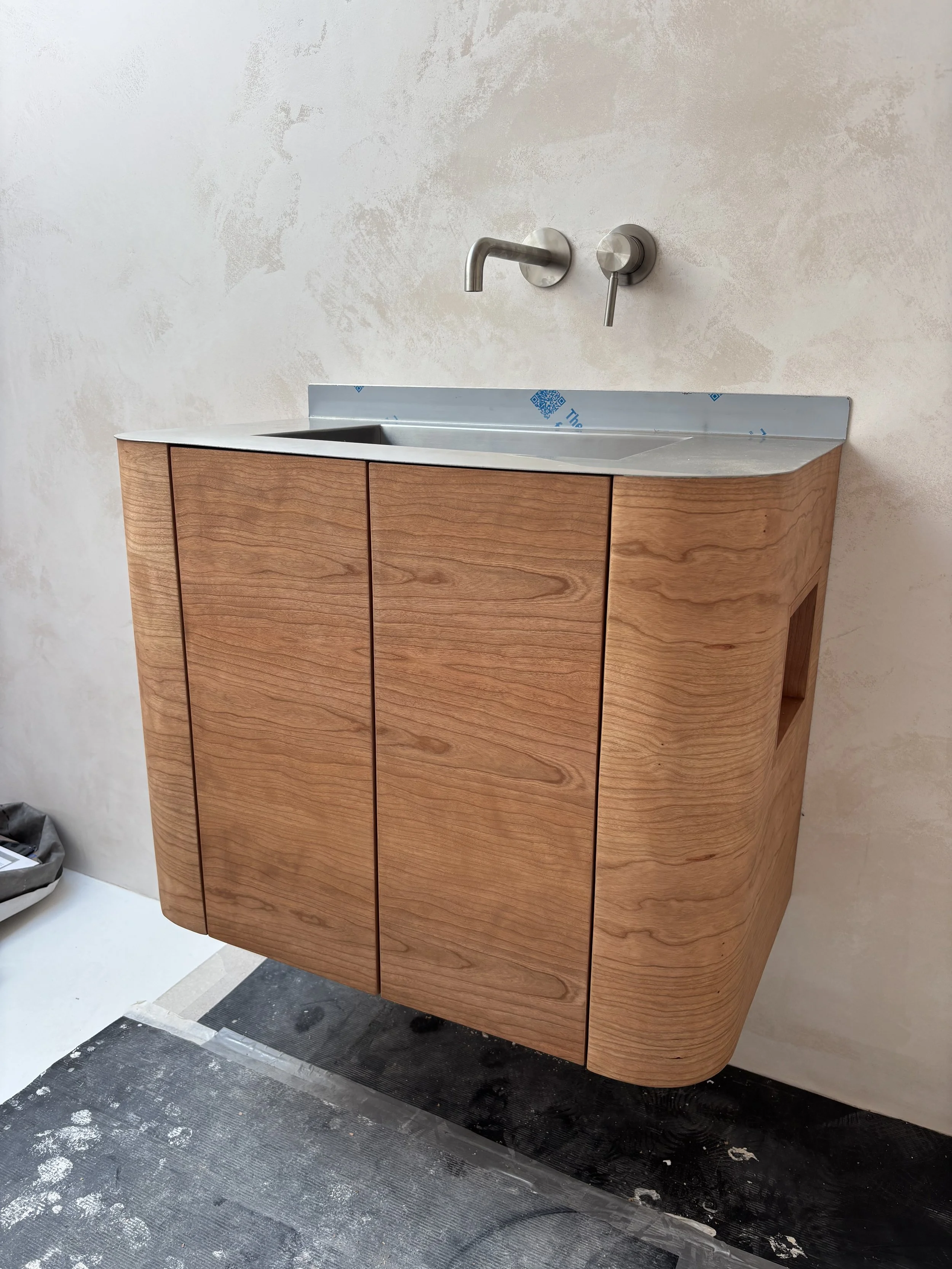 curved cherry veneered bathroom vanity unit
