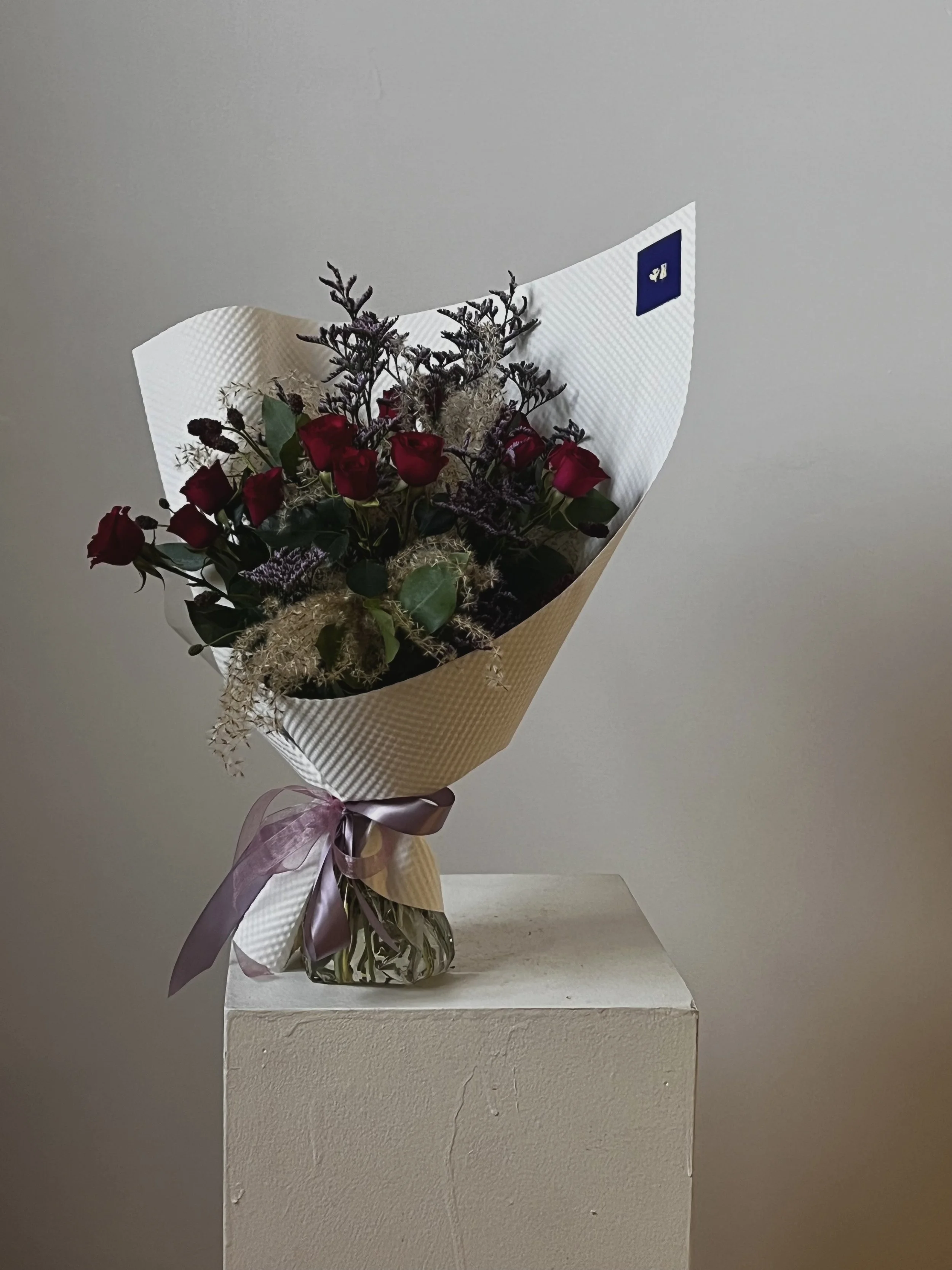 Bouquet de rosettes dans un emballage de luxe