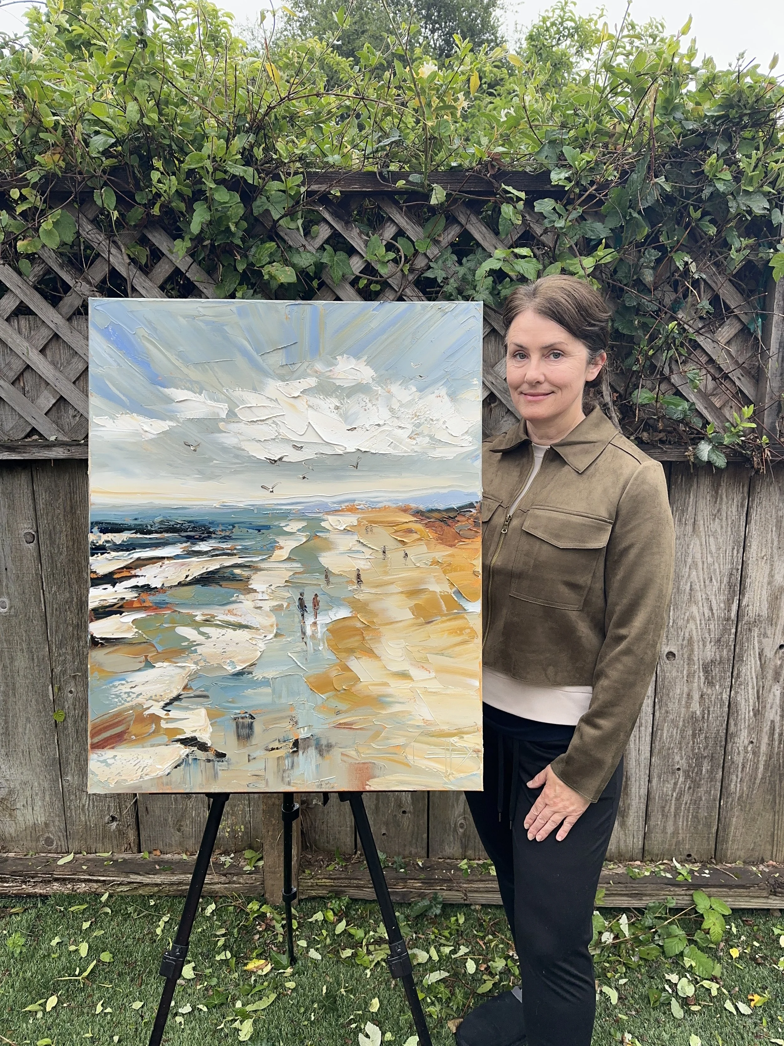Original palette knife oil painting of a quiet California shoreline with rolling waves, reflective sand, beach walkers, birds, and soft coastal sky on 16x20 gallery wrapped canvas.