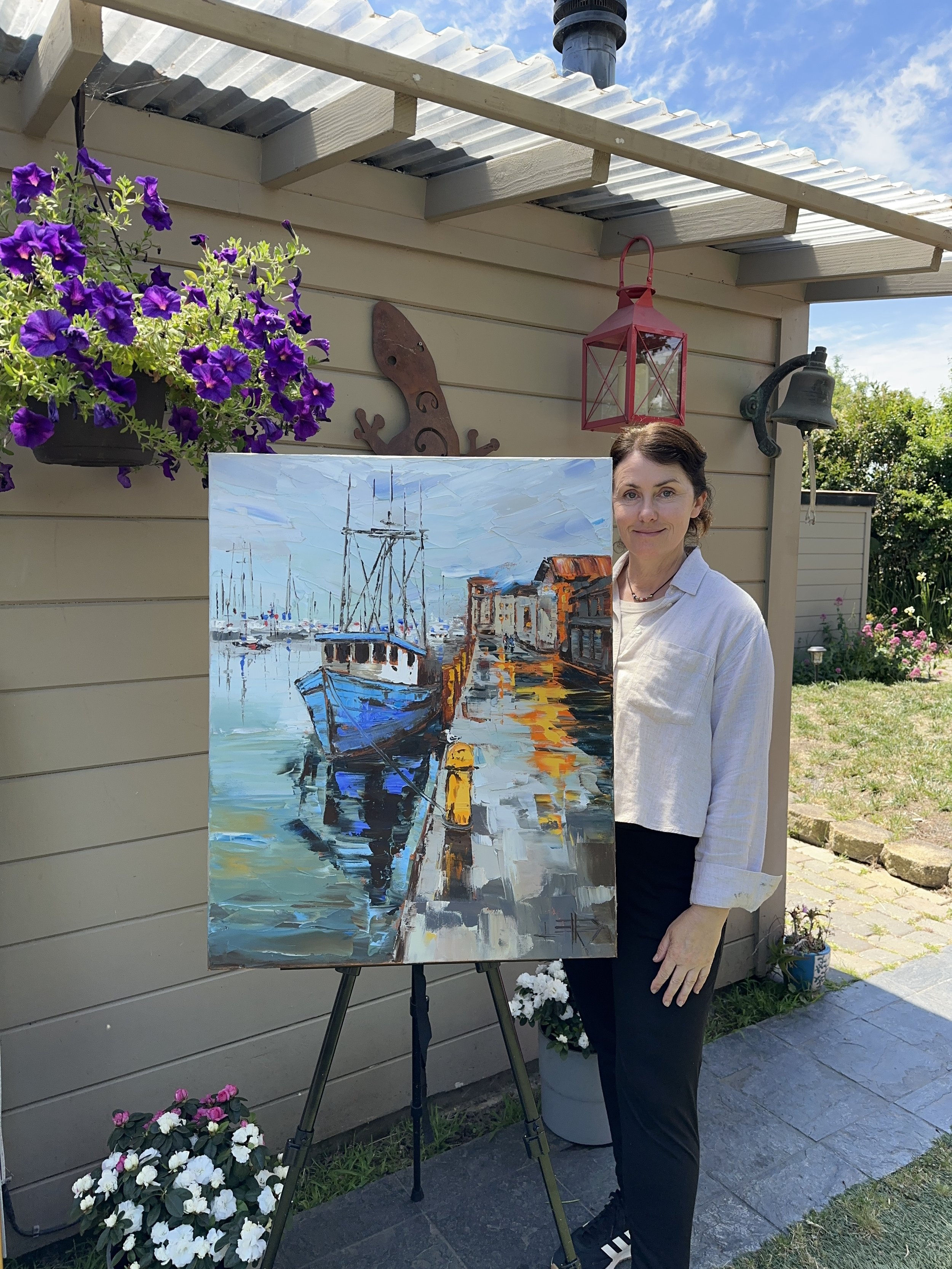 Dockside at Dusk 24x30 inch oil painting of a moored boat with warm evening light and reflections, created with palette knife texture and coastal tones.
