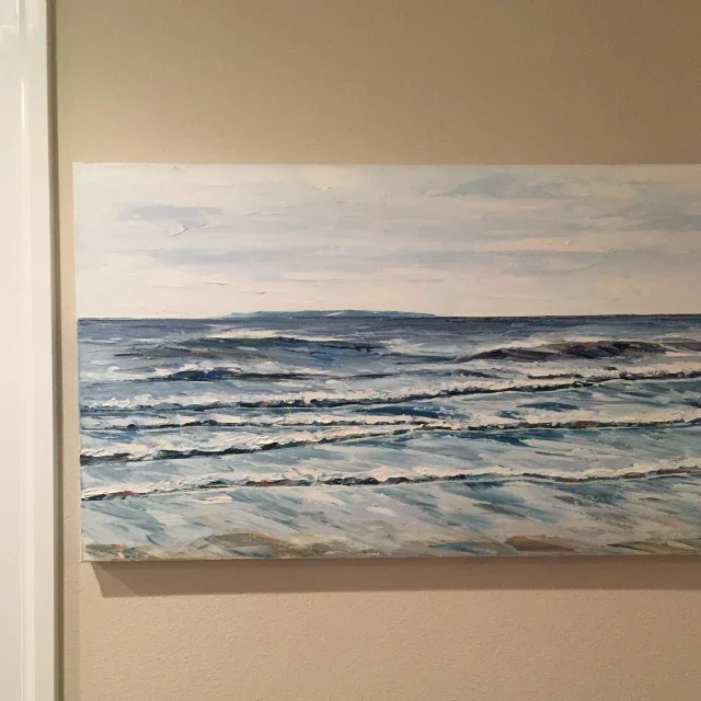 A painting of an ocean scene with waves and a distant horizon, in cool blue and gray tones.