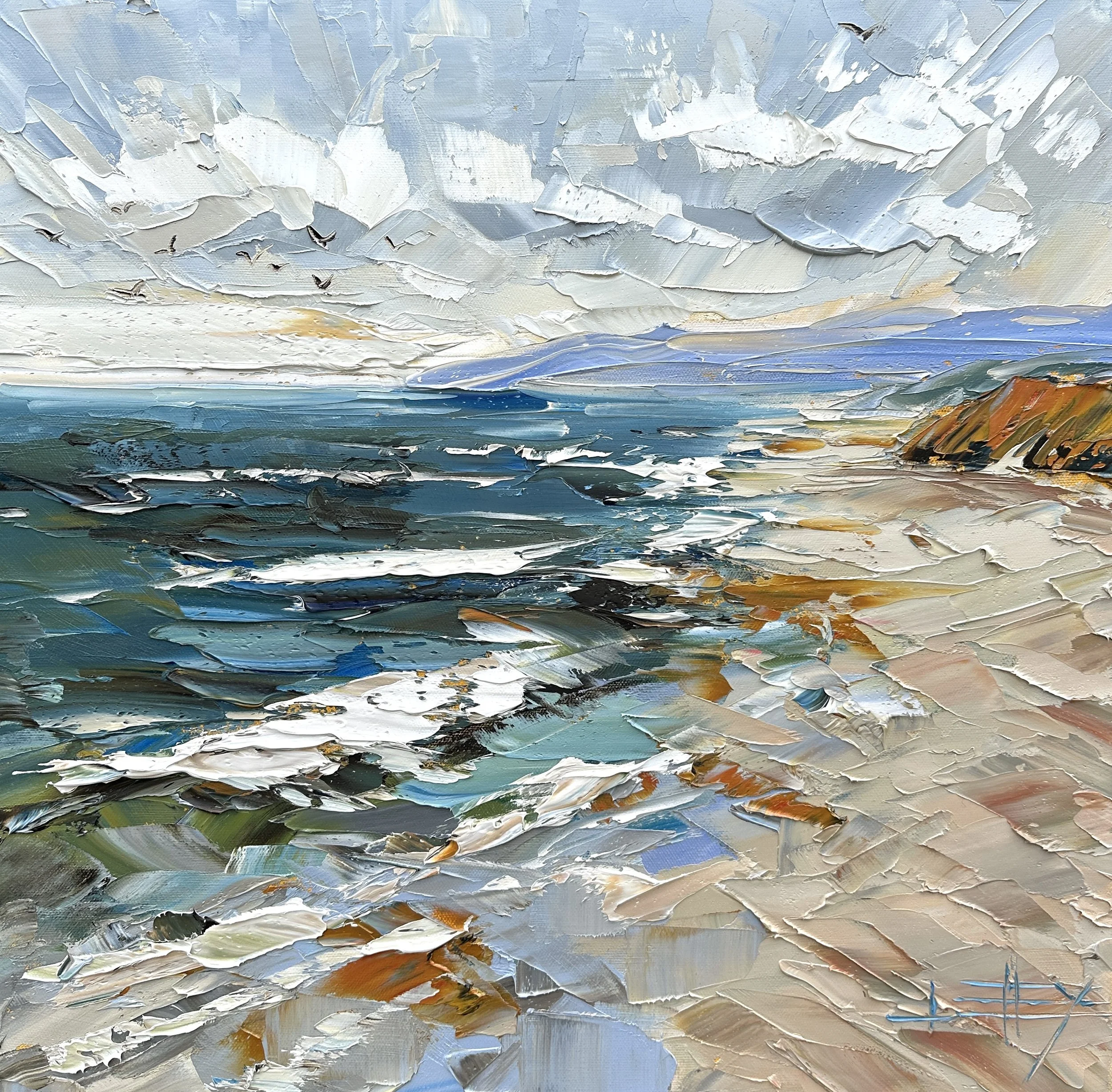 Original palette knife oil painting of the California coast with rolling ocean waves, sandy beach, warm coastal bluff, distant blue headland, and textured sky on gallery wrapped canvas.