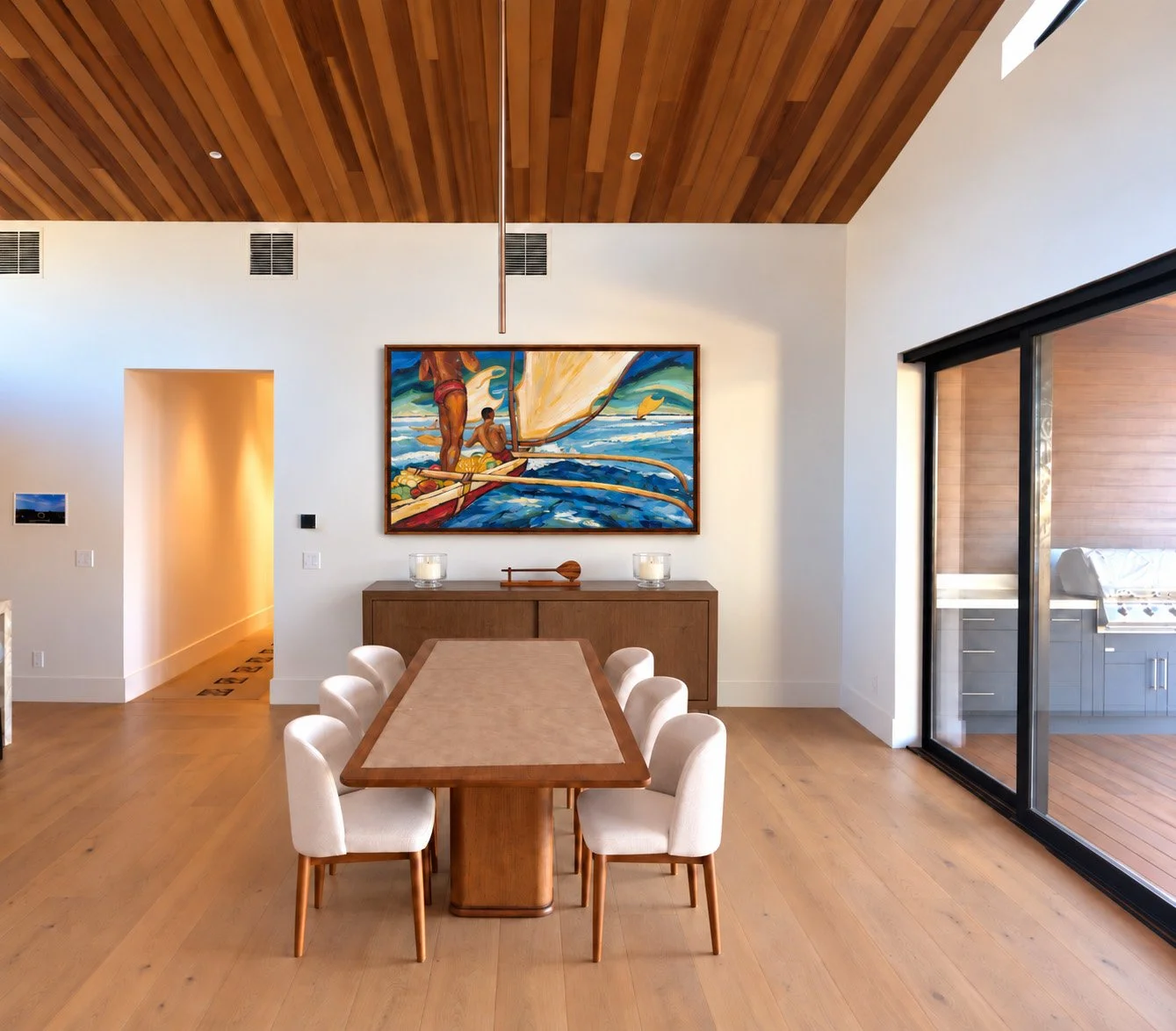 Warm wood console beneath outrigger painting appreciation.jpg