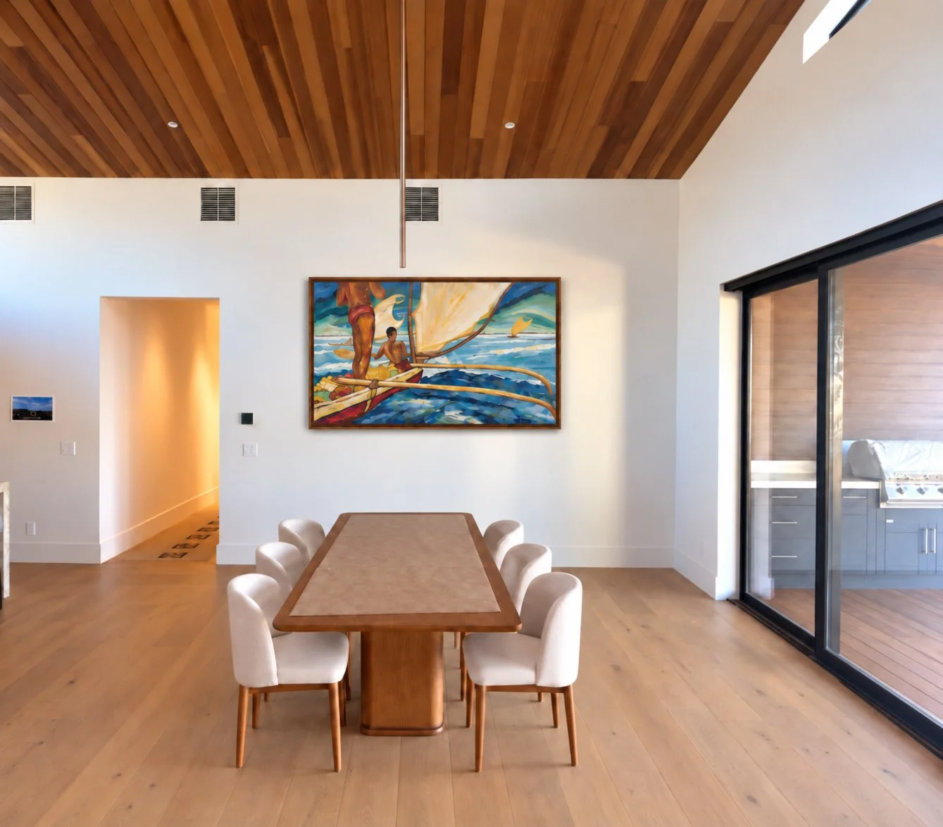 Modern dining room with wood ceiling, light hardwood floor, white walls, and a large painting of people on a boat hanging on the wall. A wooden dining table with six white chairs is in the center, adjacent to sliding glass doors leading to an outdoor