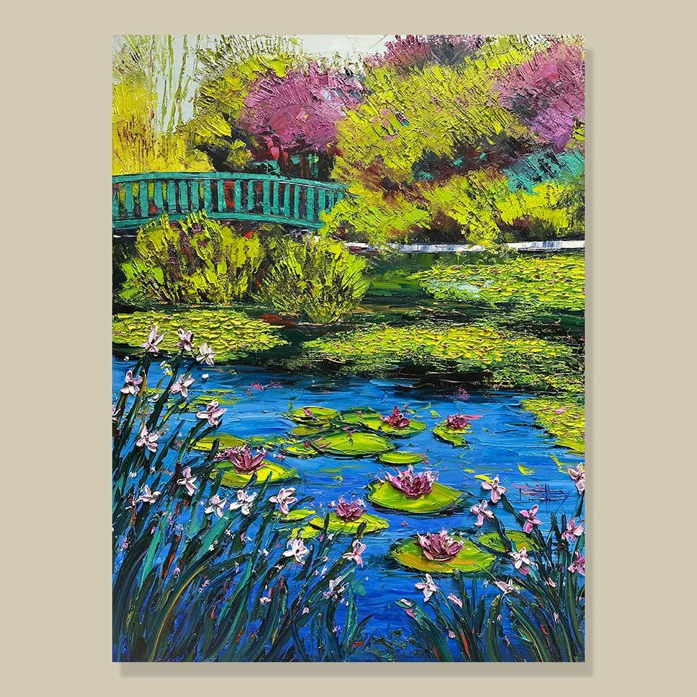 Waterlily Garden original oil painting inspired by Monet’s gardens at Giverny, featuring blooming waterlilies, a Japanese bridge, flowering trees, and rich palette knife texture by Lisa Elley.
