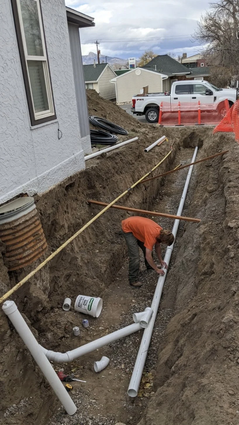 Excavation contractor dirt work sewer line repair install City of Cody Wyoming trenches water line gas line