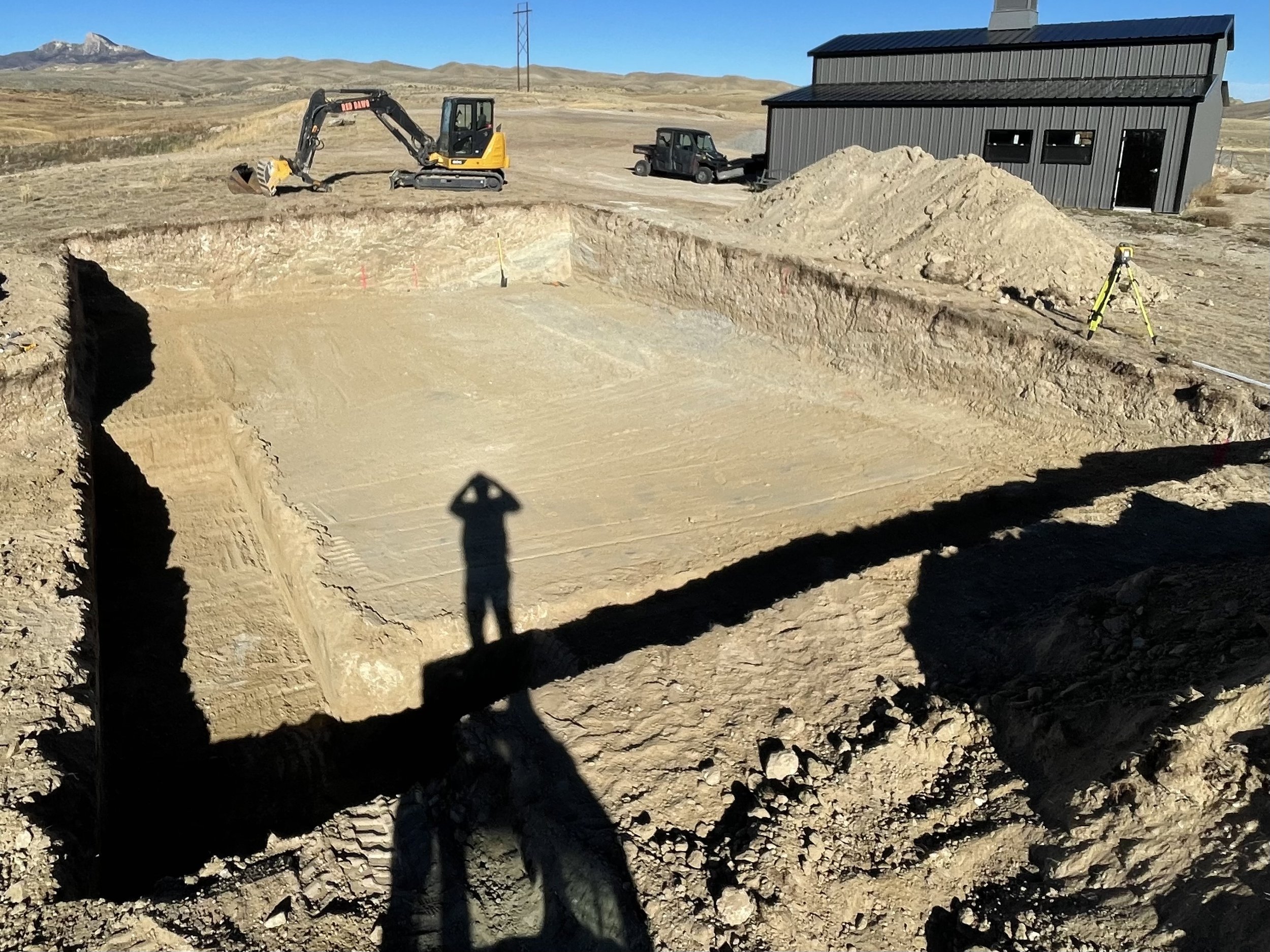 Cody Wyoming Park County excavator dirt work basement foundation footings dream home new home construction sewer line septic tank